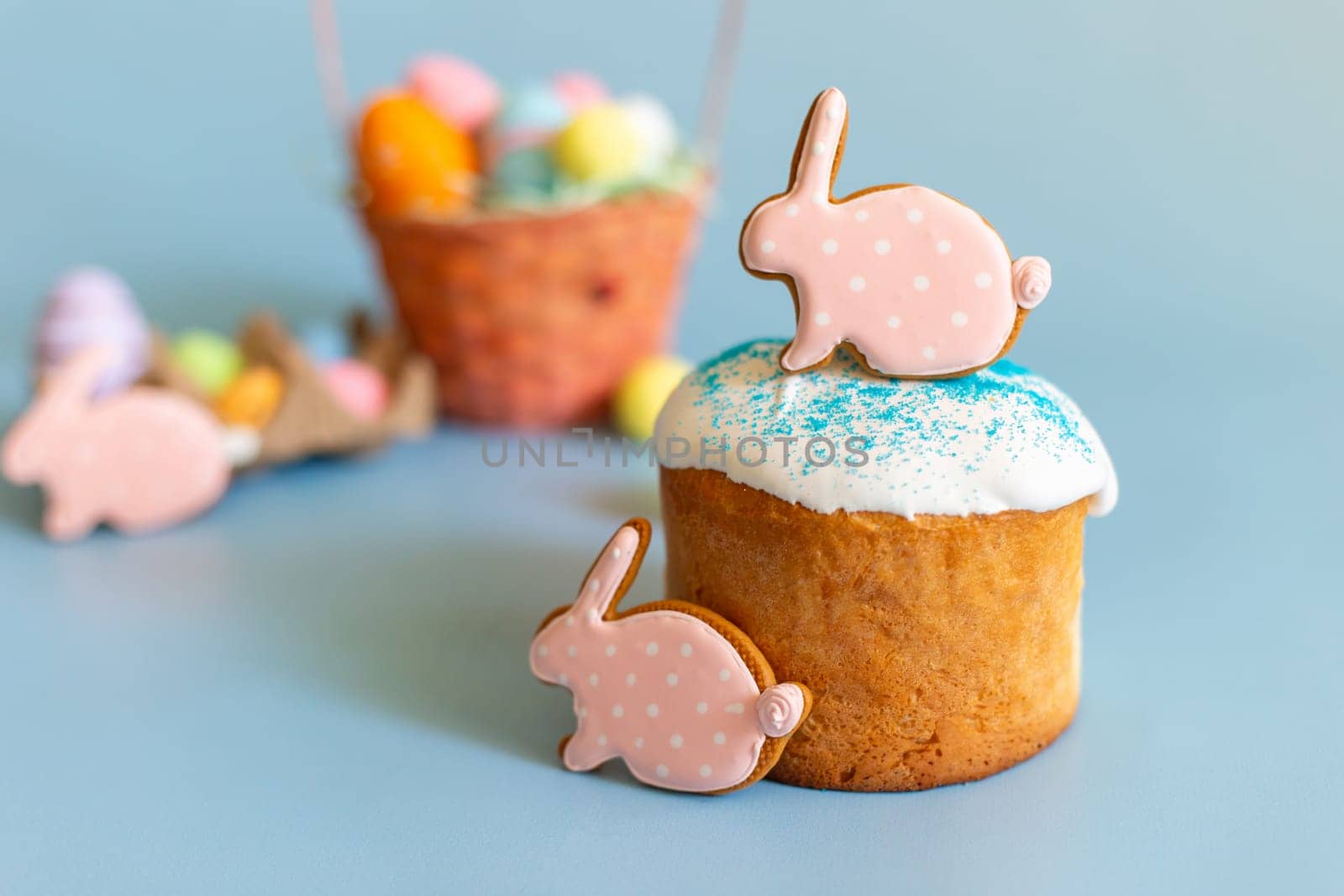 Easter still life with gingerbread in the form of a rabbit on an Easter cake.