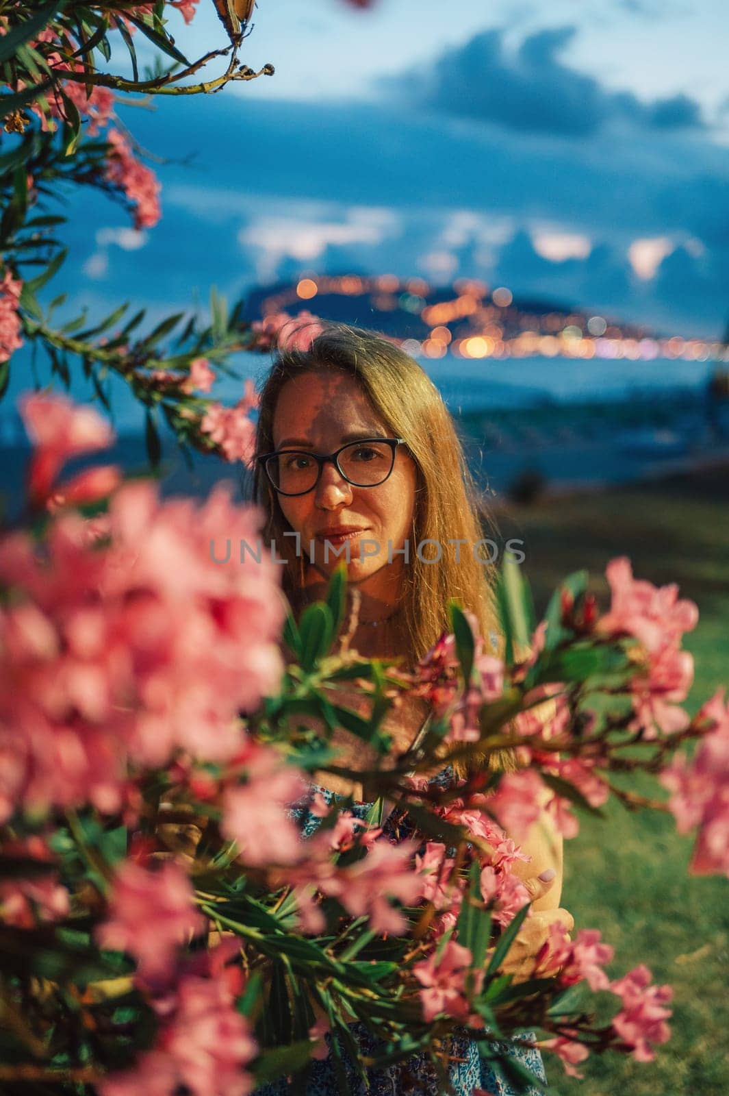 Woman sits on the beach and looks at the sea in Alanya city, Turkey. Travelling or vacation concept