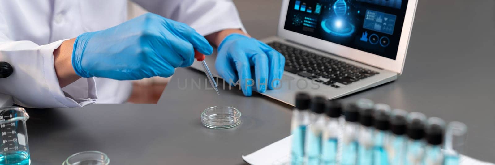 Scientist conduct chemical experiment in medical laboratory, carefully drop precise amount of liquid from pipette into test tube for vaccine drug or antibiotic development. Neoteric