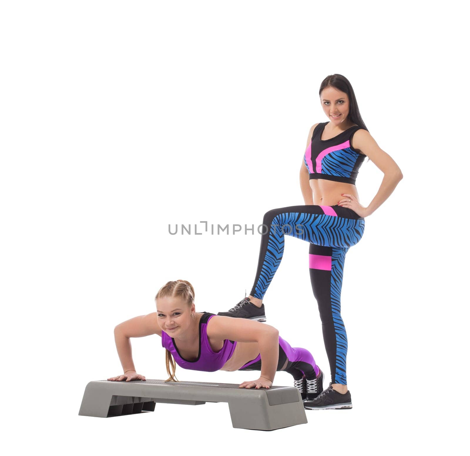 Cute sporty girl helping her partner to train, isolated on white