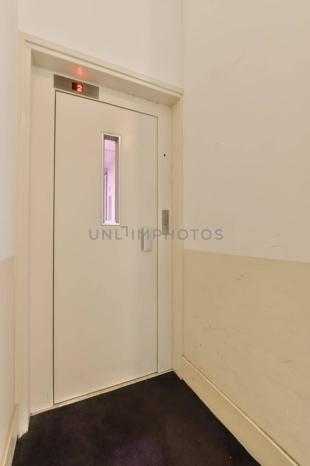 a white door with a window in a white room by casamedia