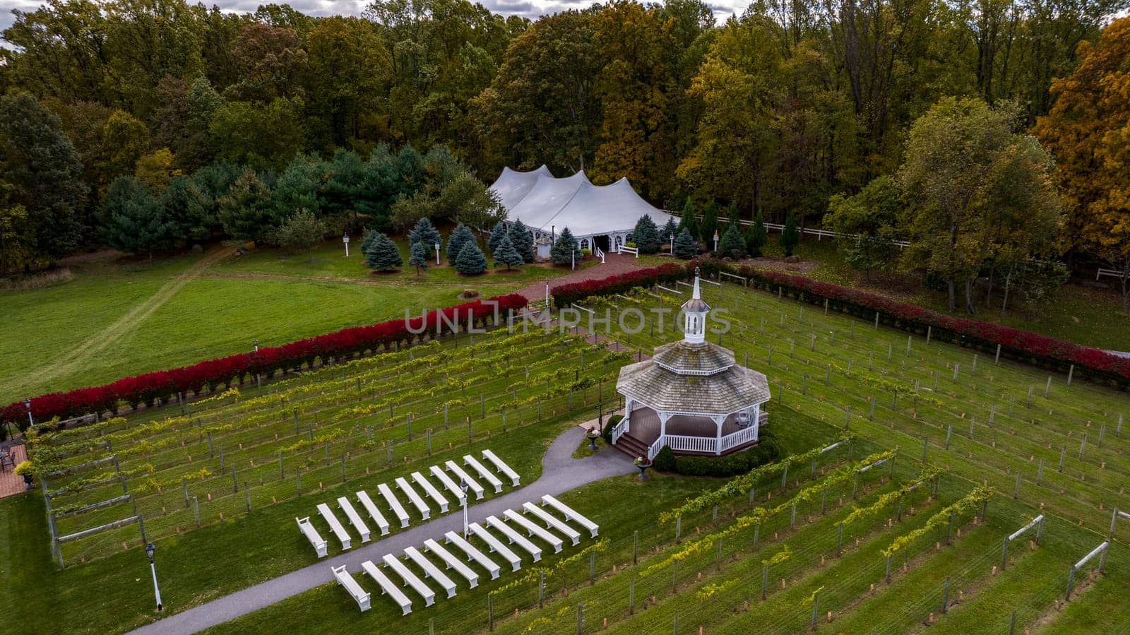 Elizabethtown, Pennsylvania, October 22, 2023 - An Aerial View of a Large Gazebo in the Middle of a Vineyard, With Seating for a Weddings on an Autumn Day