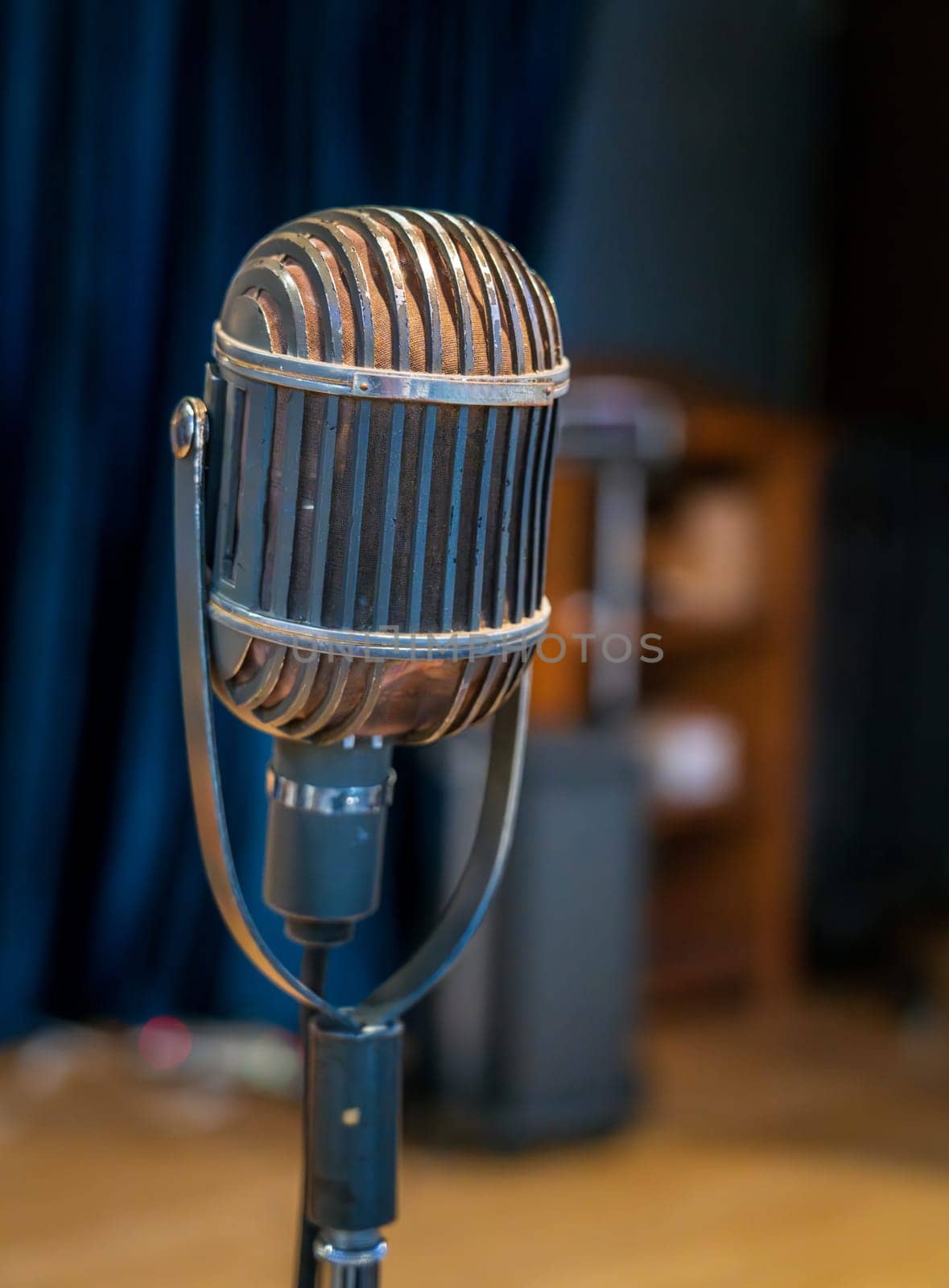Old fashioned studio microphone on stage by steheap