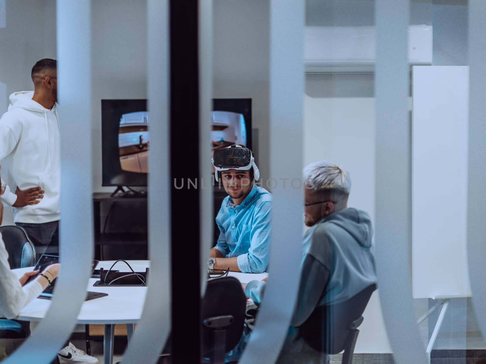 A diverse group of businessmen collaborates and tests a new virtual reality technology, wearing virtual glasses, showcasing innovation and creativity in their futuristic workspace.
