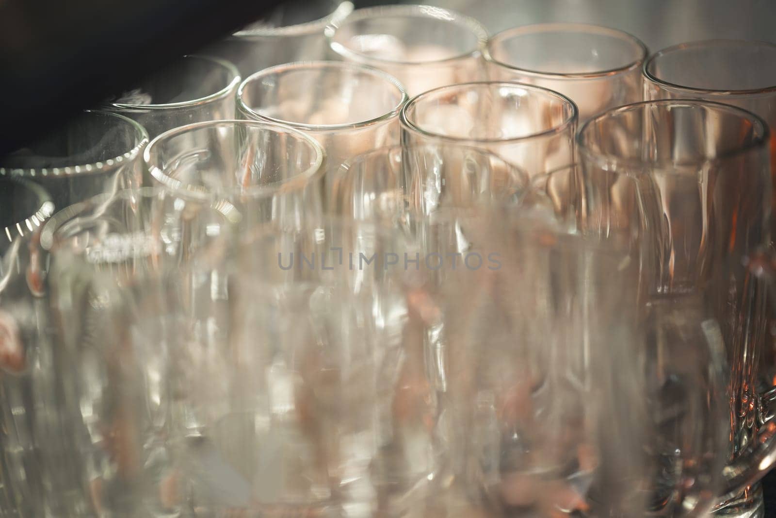 Reflective glassware on a surface by Studia72