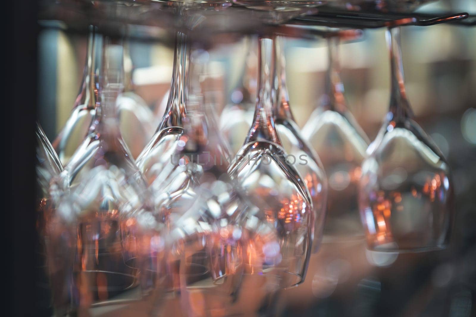 Stacks of shining glasses catch the light, emphasizing their pristine quality and arrangement.