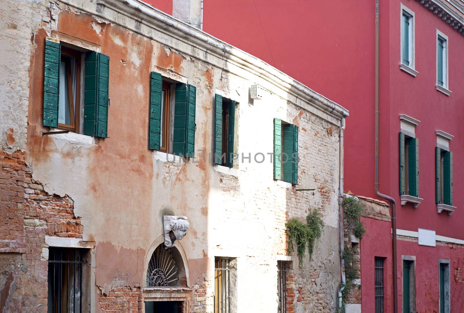 windows in Venice. Architecture. Wooden door and windows, building exterior in Venice, exterior design