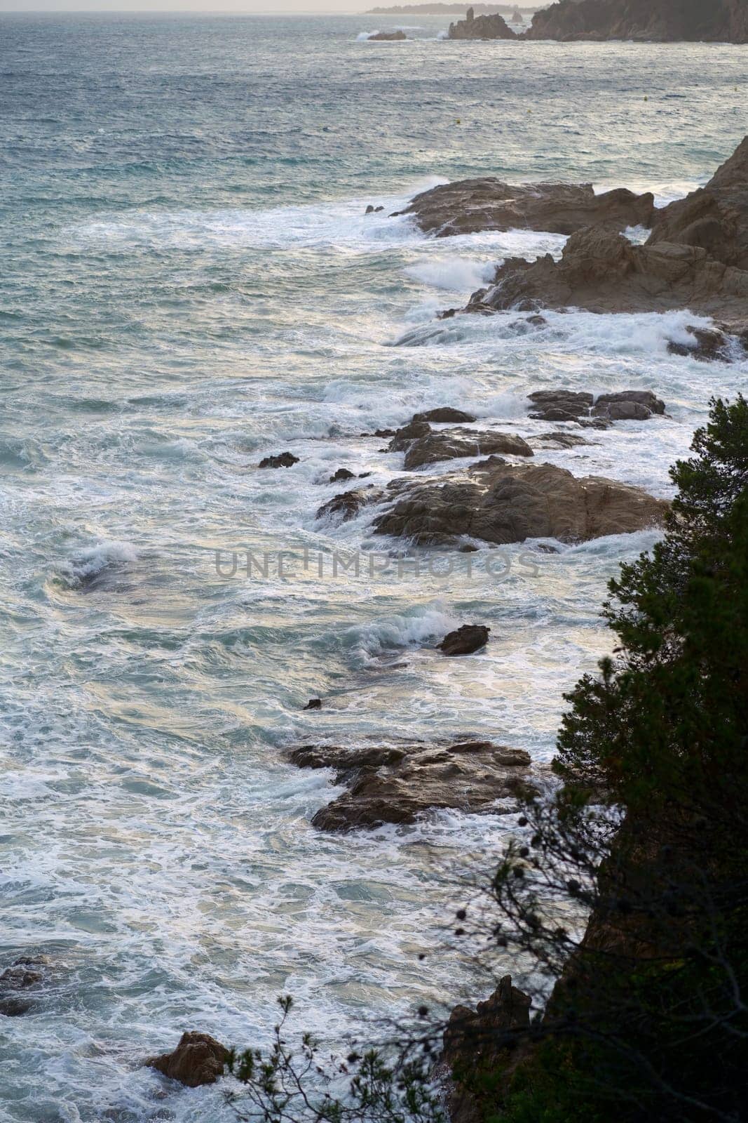 vertiginous, swirling foamy water waves photographed from above