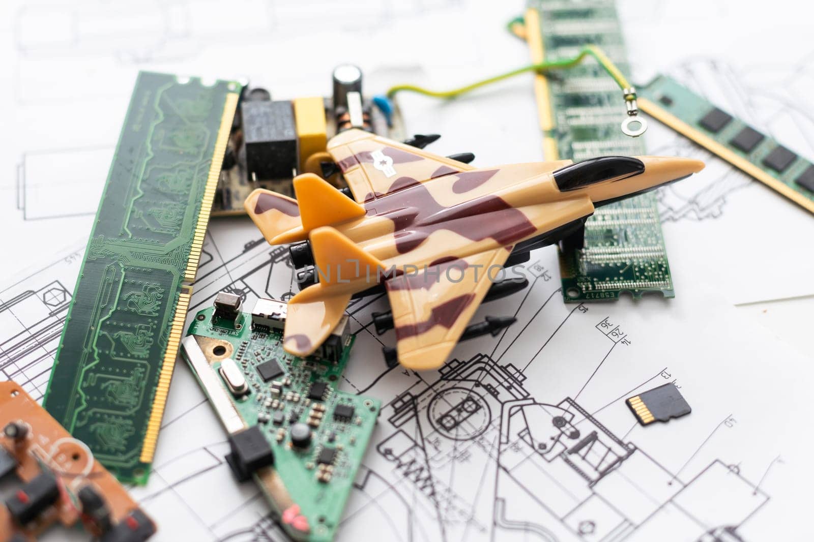 Electronic circuit board close up with airplan toy. High quality photo