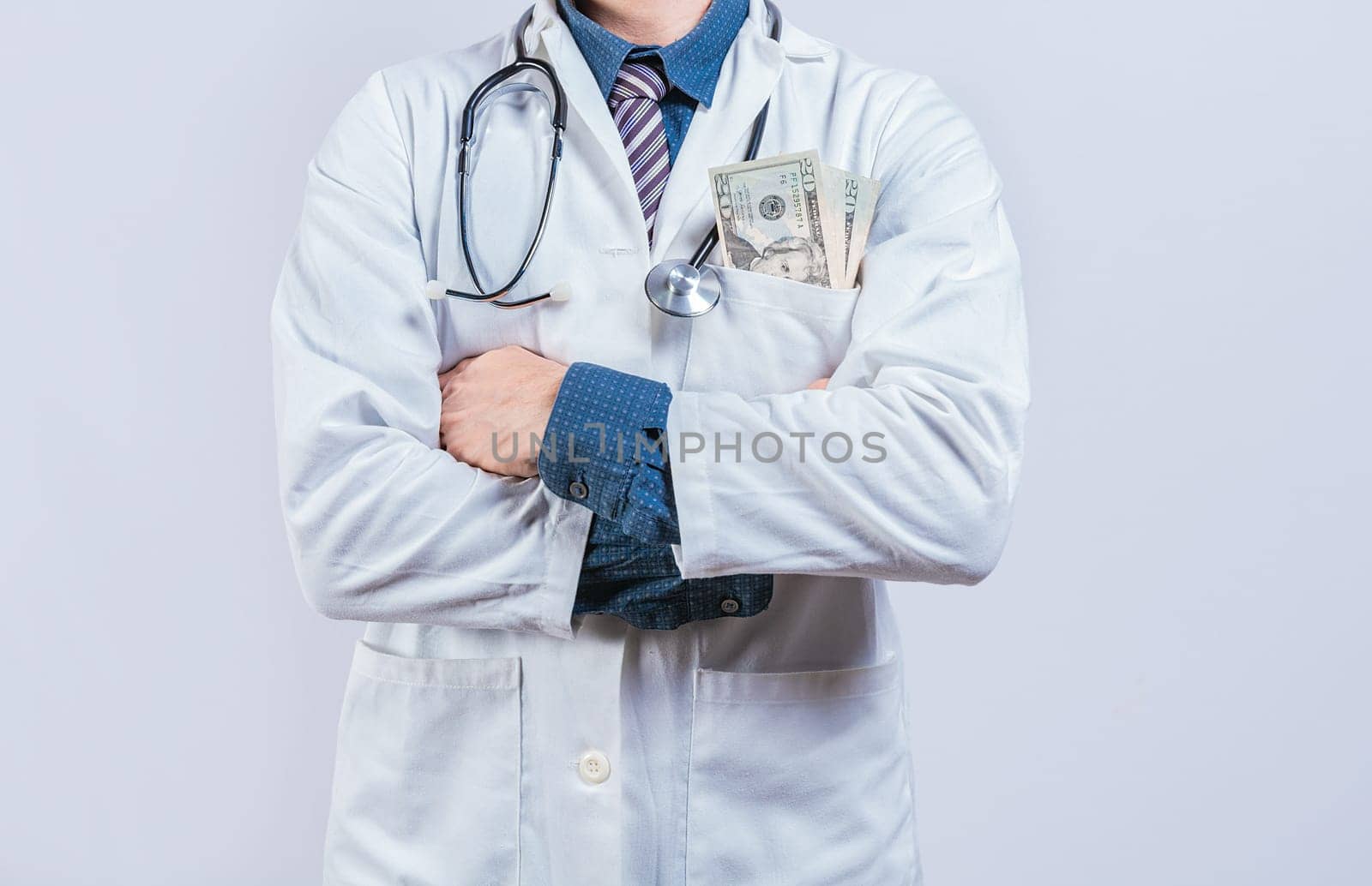 Corrupt doctor with bribe money in pocket isolated. Medical bribery concept. Bribed doctor with money in pocket isolated. 