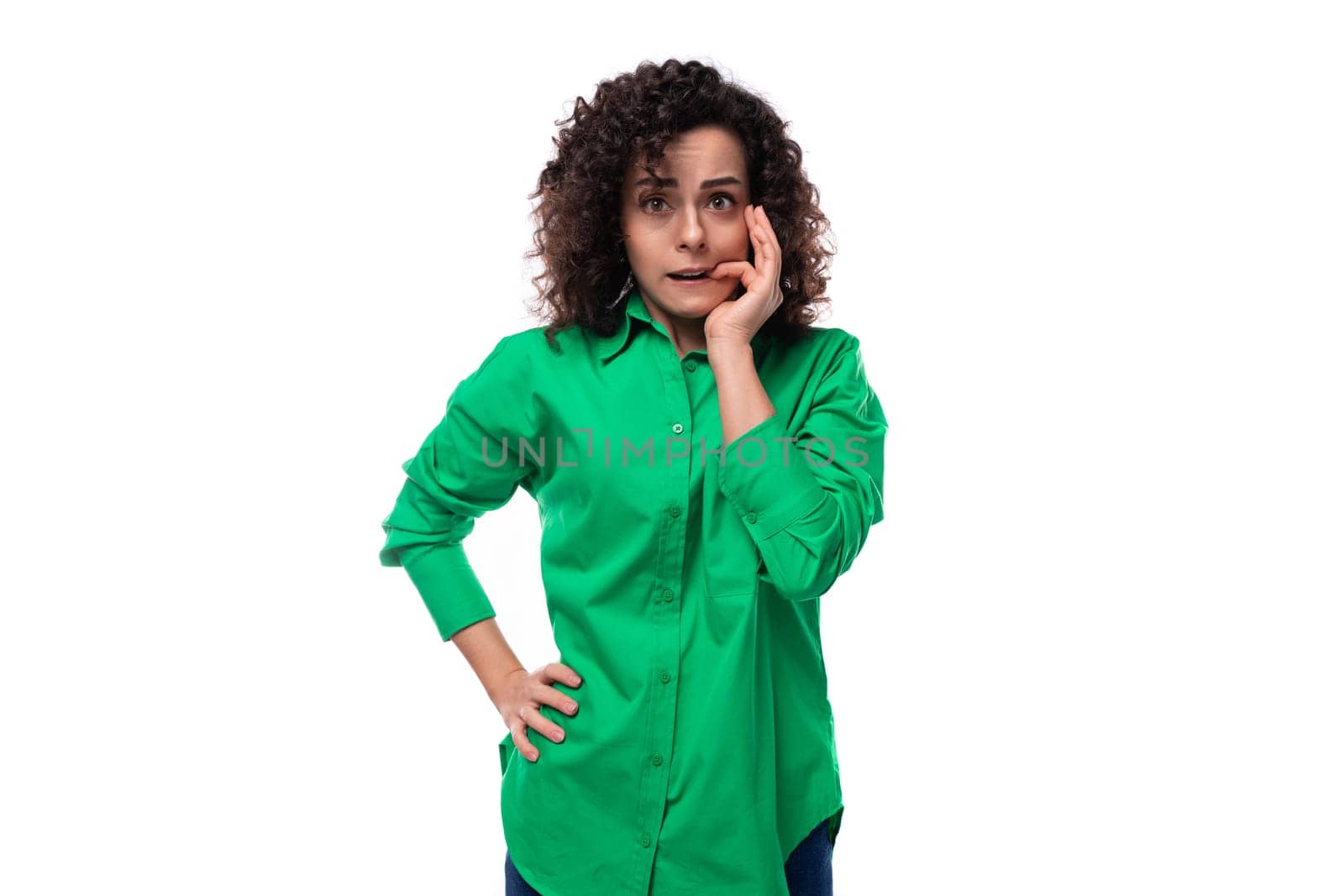pretty young business woman dressed in a green shirt is brainstorming by TRMK