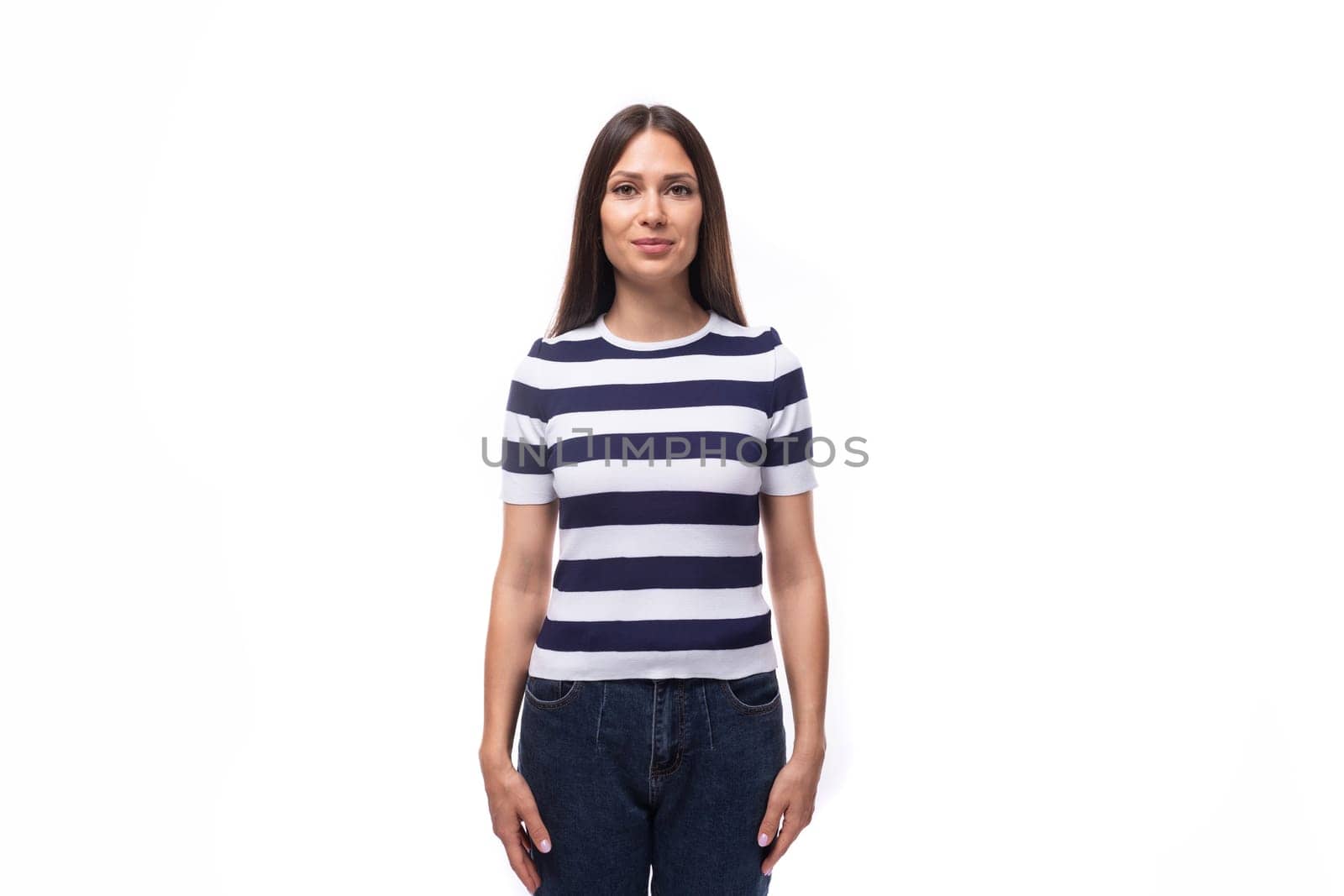 pretty slim young brunette woman in a striped t-shirt on a white background with copy space by TRMK