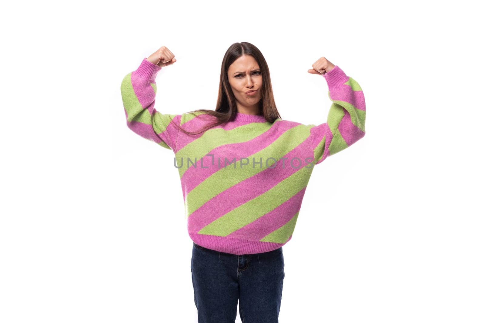 portrait of a well-groomed 35 year old feminine model woman dressed in a pink stylish pullover on a white background with copy space by TRMK