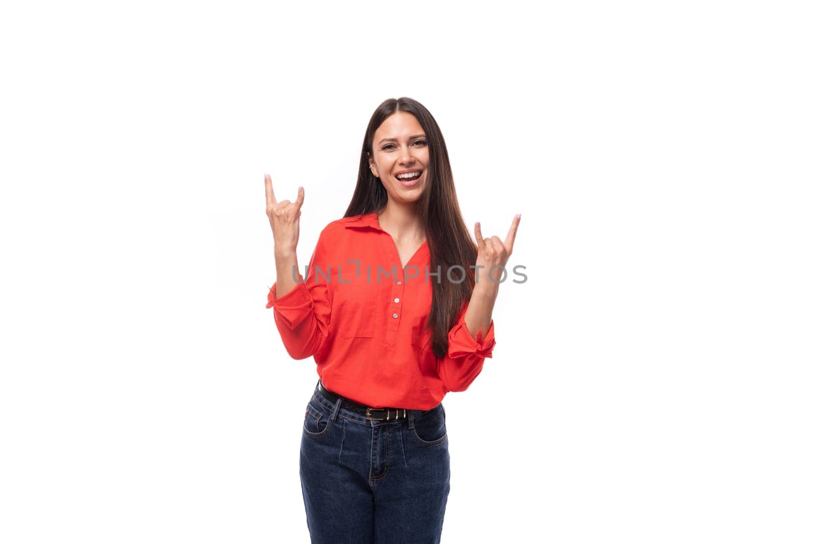 young office worker woman with black hair is dressed in a red blouse tucked into trousers on a white background by TRMK