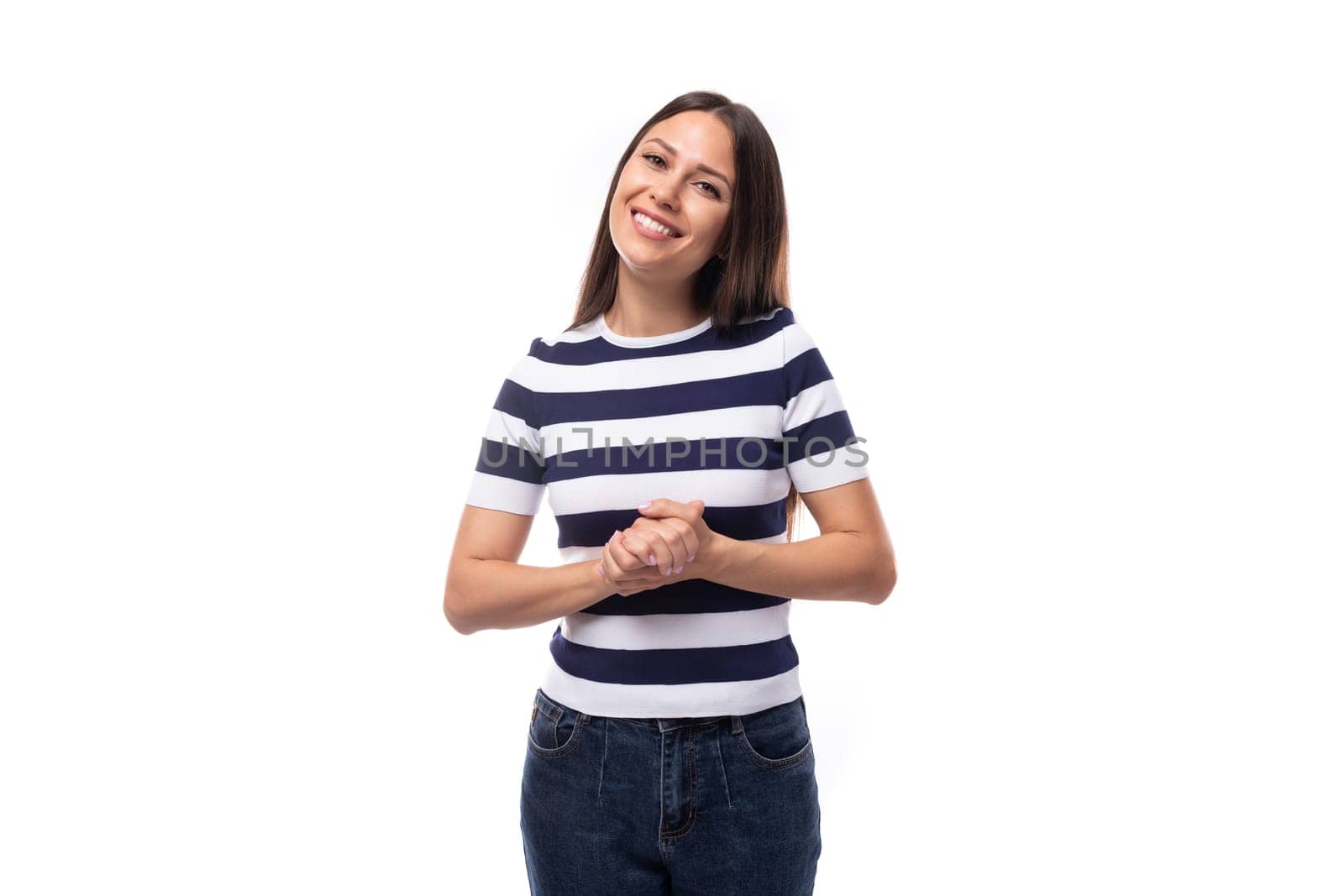 joyful young european promoter woman with black straight hair in a striped black and white t-shirt and jeans.