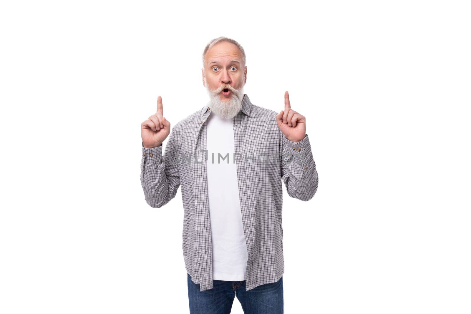 well-groomed gray-haired senior man with a beard and mustache in a shirt is confident.