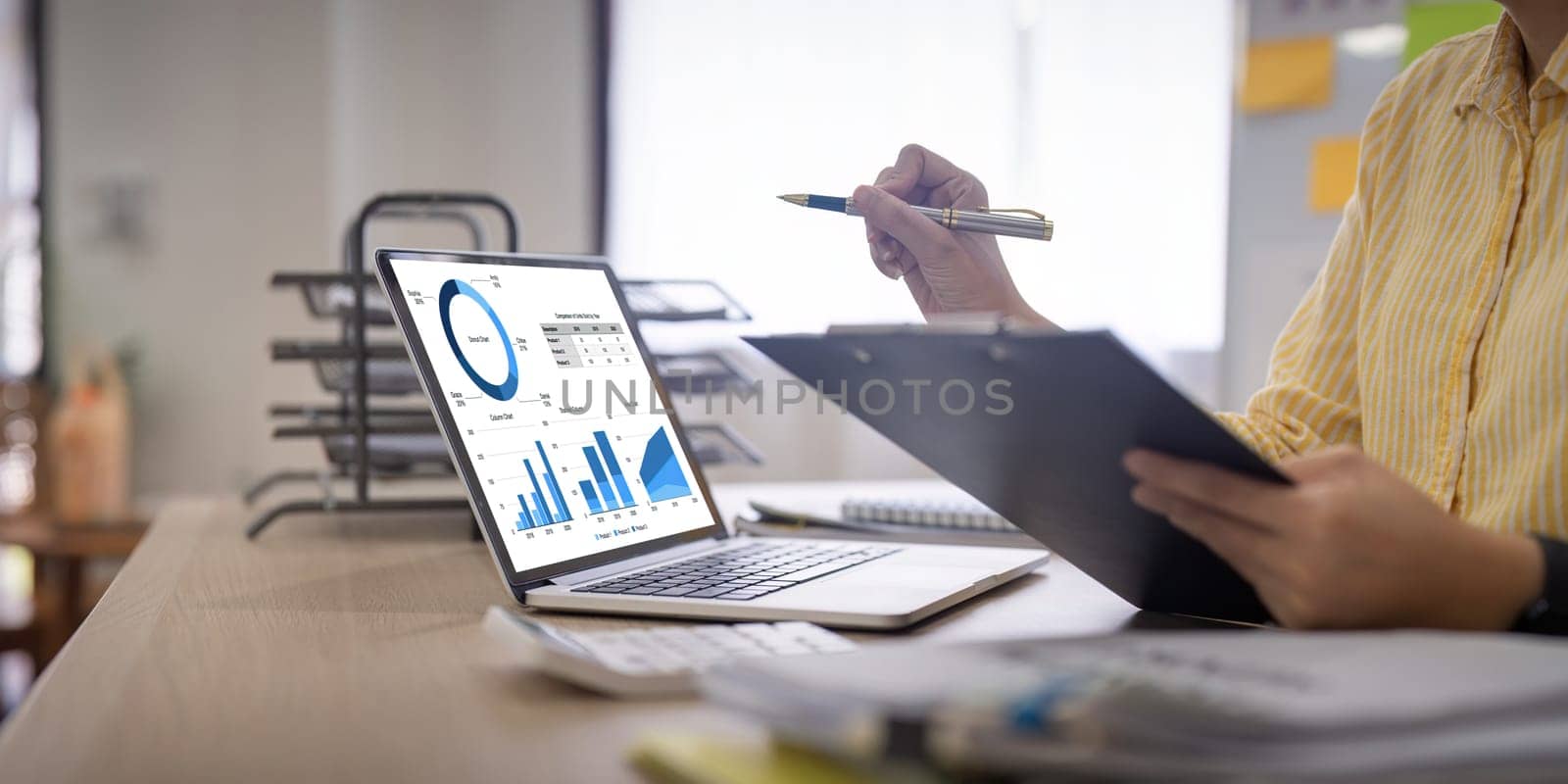 Businesswoman or accountant working financial investment on calculator, calculate, analyze business and marketing growth on financial document data graph.