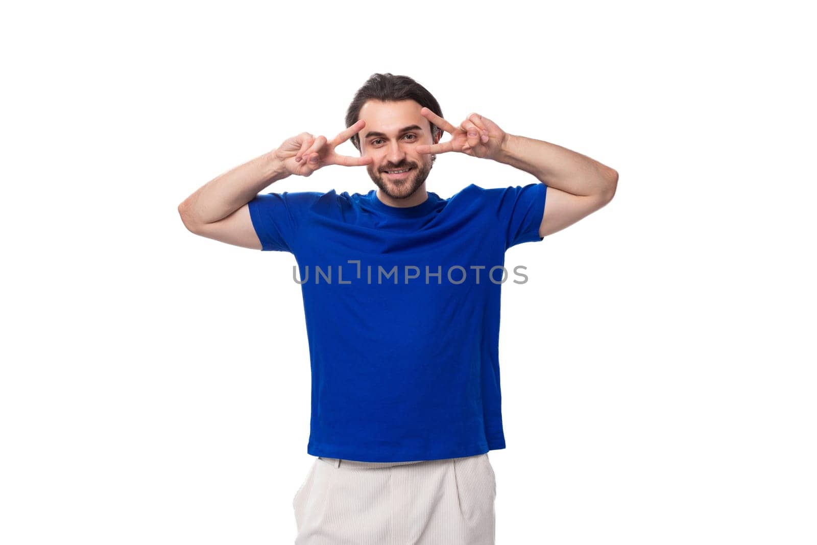 young european brunette man with beard dressed in blue t-shirt with identity print mockup by TRMK