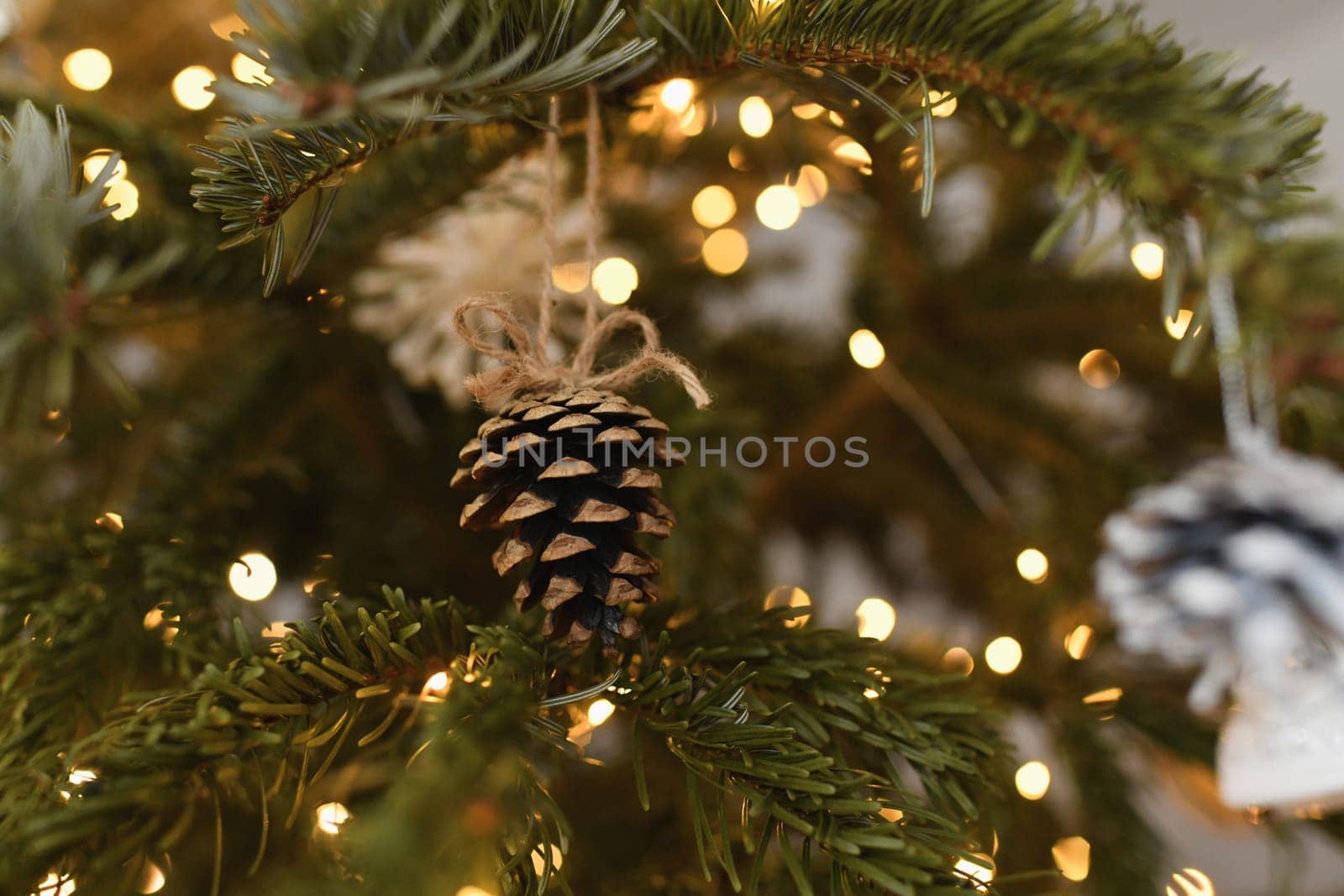 Cone toy hanging on the christmas tree