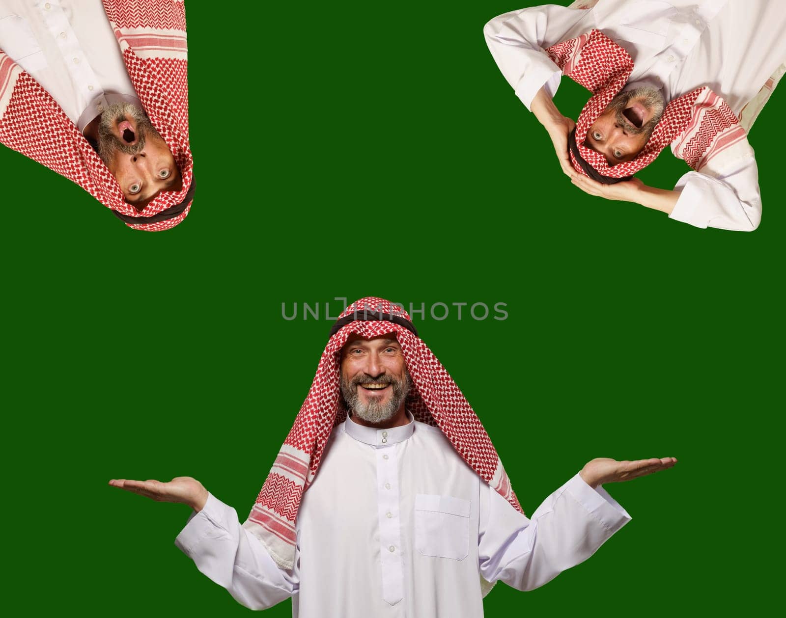 Smiling Arab man expresses happiness and makes choice, creating empty blank space for your text. Isolated on green background, radiates positivity, contentment, and joy of making decisions. by LipikStockMedia
