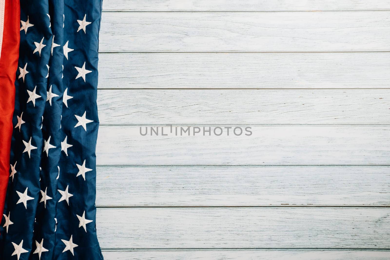 A patriotic scene for Veterans Day, American flags on a wooden background, symbolizing honor, pride, and democracy. November 11 is a day to celebrate our veterans.