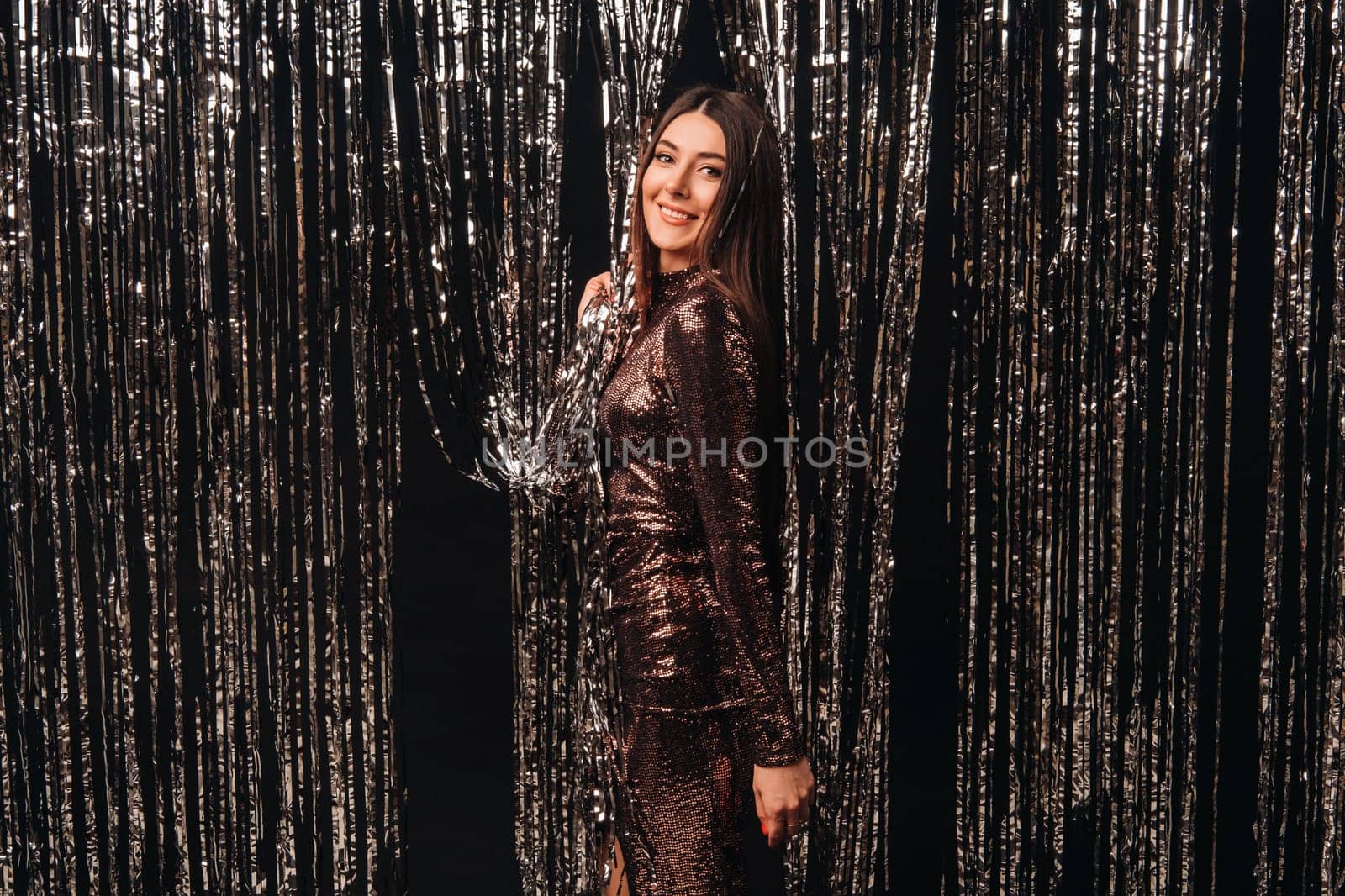 girl in a shiny dress on a silver background of New Year's rain by Lobachad