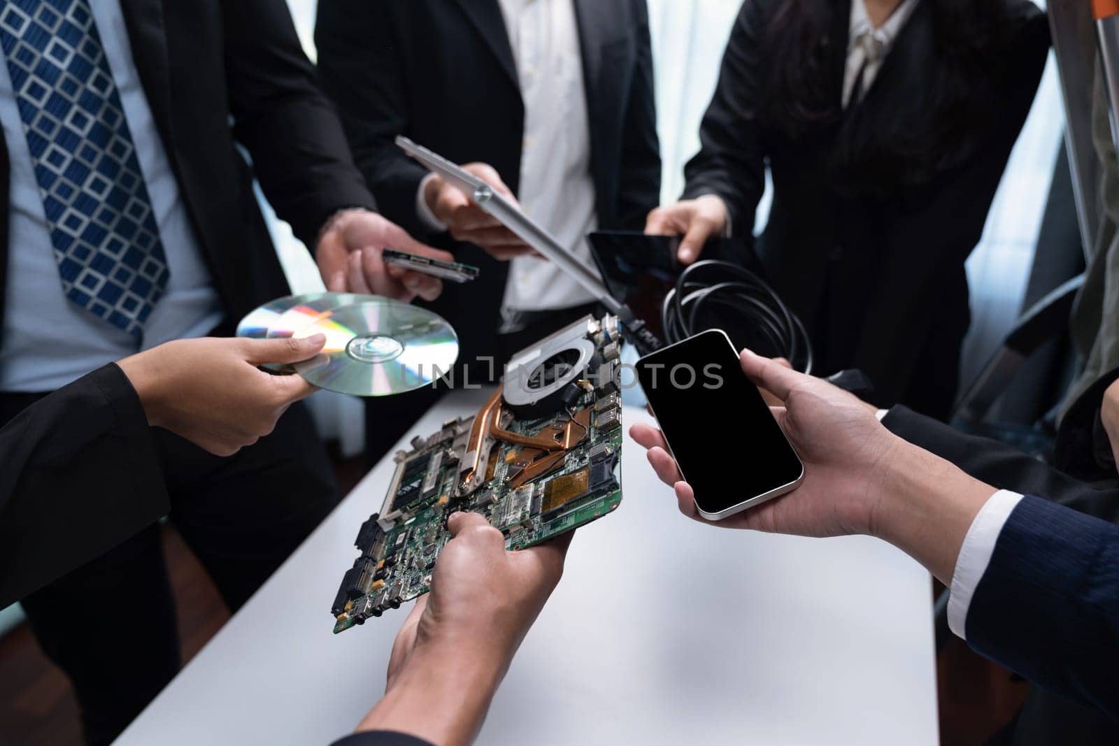 Business people holding electronic waste as eco-business recycle waste policy in corporate responsibility. Reuse, reduce and recycle for sustainability environment. Quaint