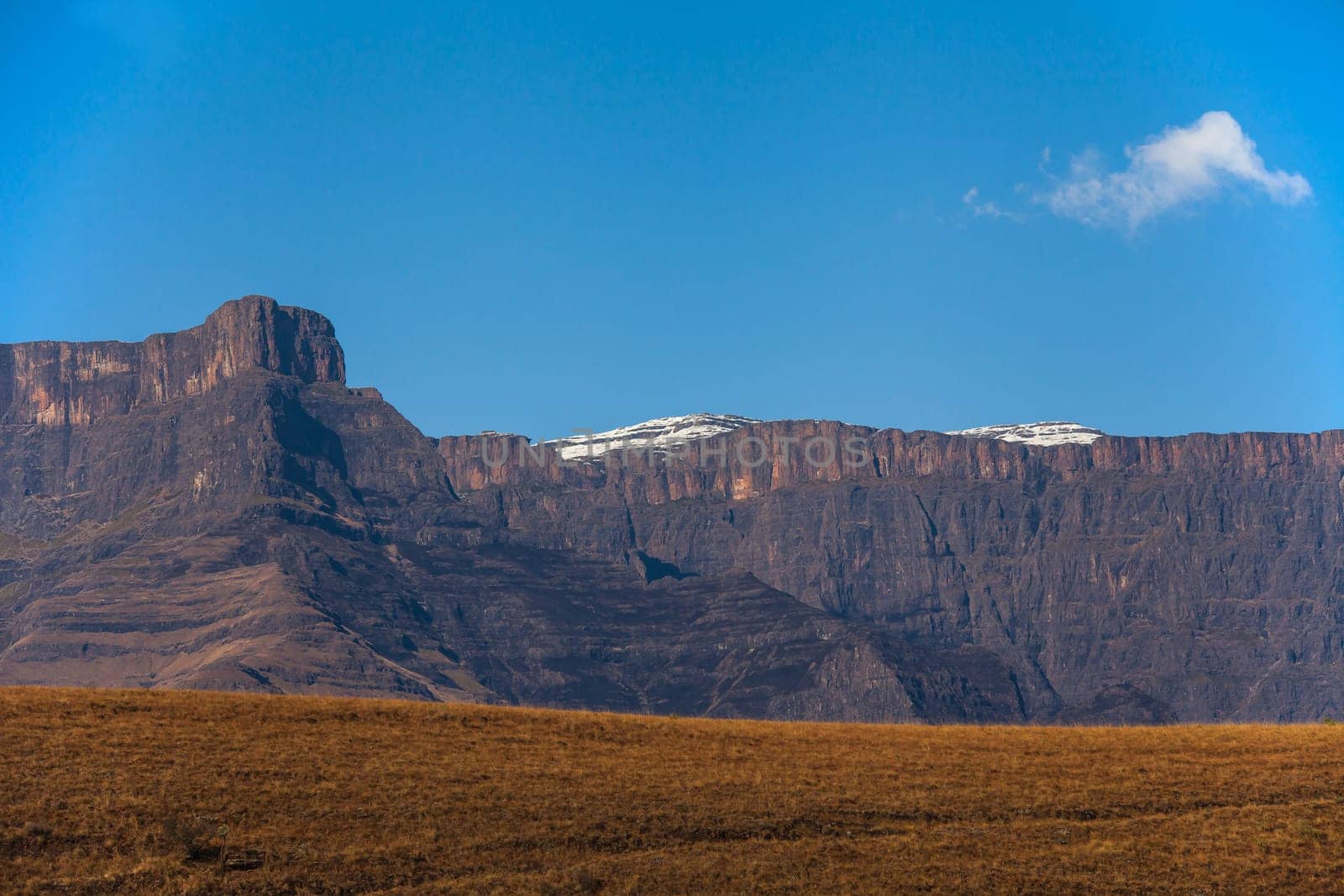 The Amphitheater formation with a light dusting of snow seen from the Royal Natal National Park in the Drakensberg South Africa