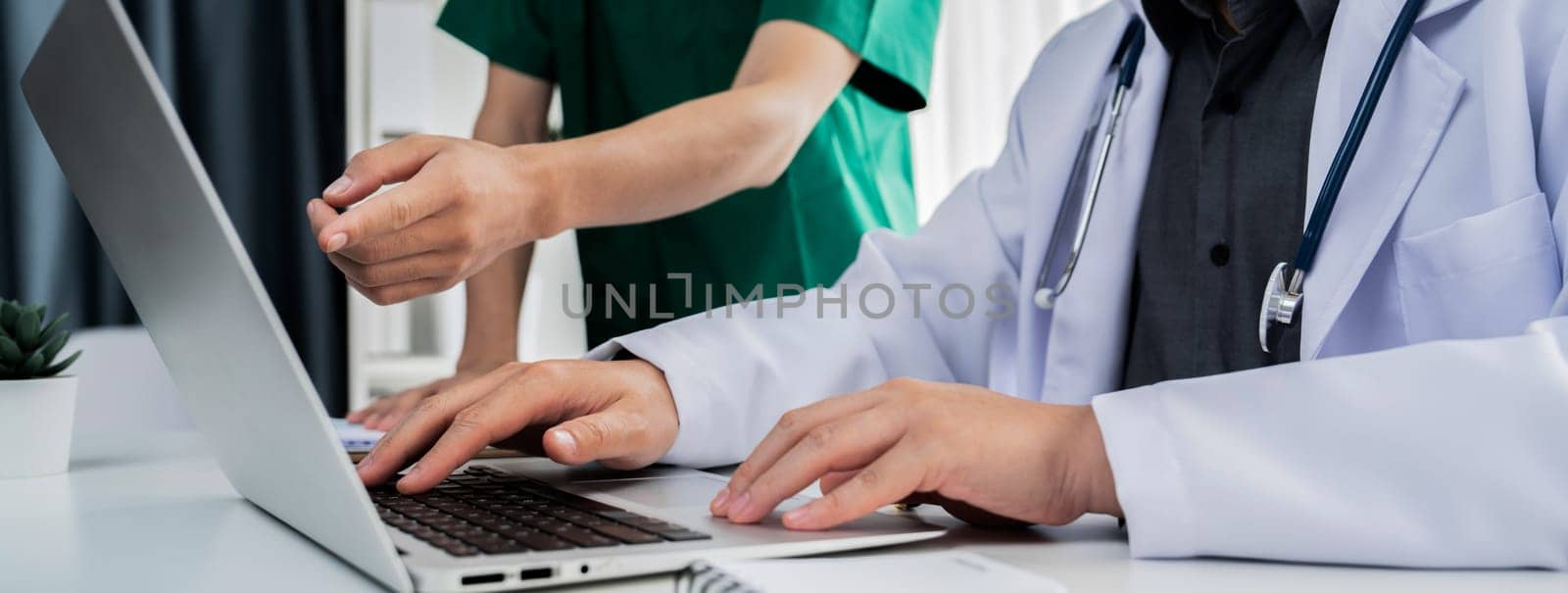 Professional various team of medical working and planning medical treatment at hospital table together. Teamwork lead to successful illness and sickness treatment. Panorama Rigid