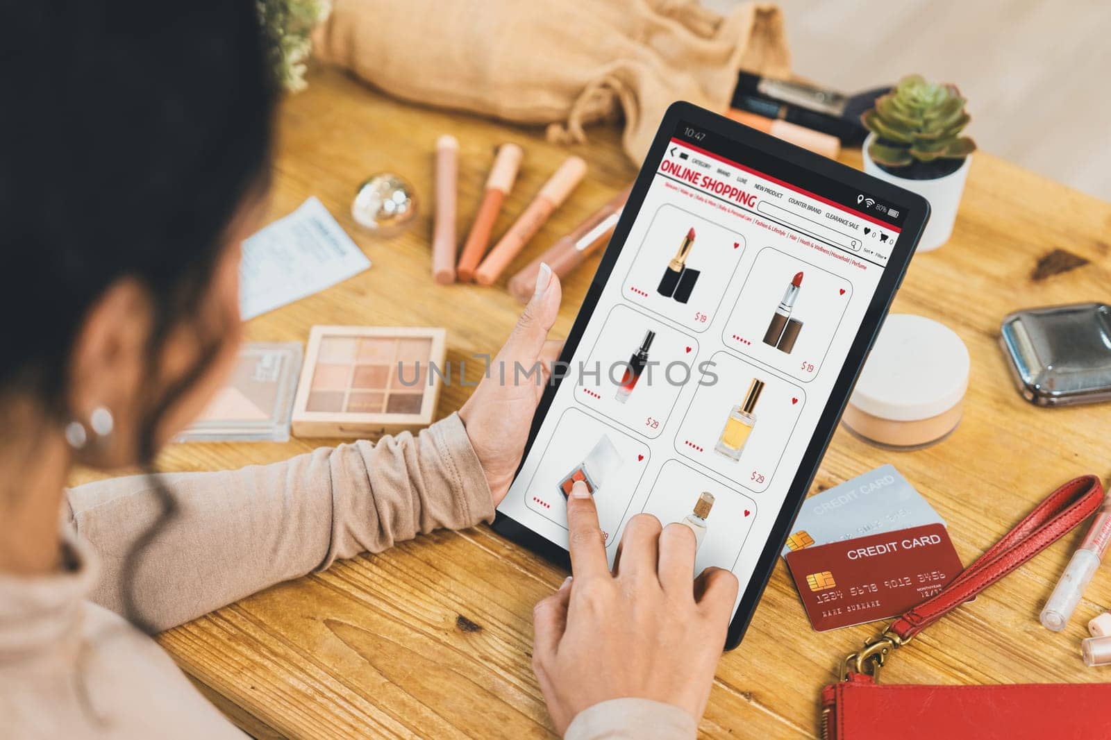 Woman shopping online on internet marketplace browsing for sale items for modern lifestyle and use credit card for online payment from wallet protected by crucial cyber security software