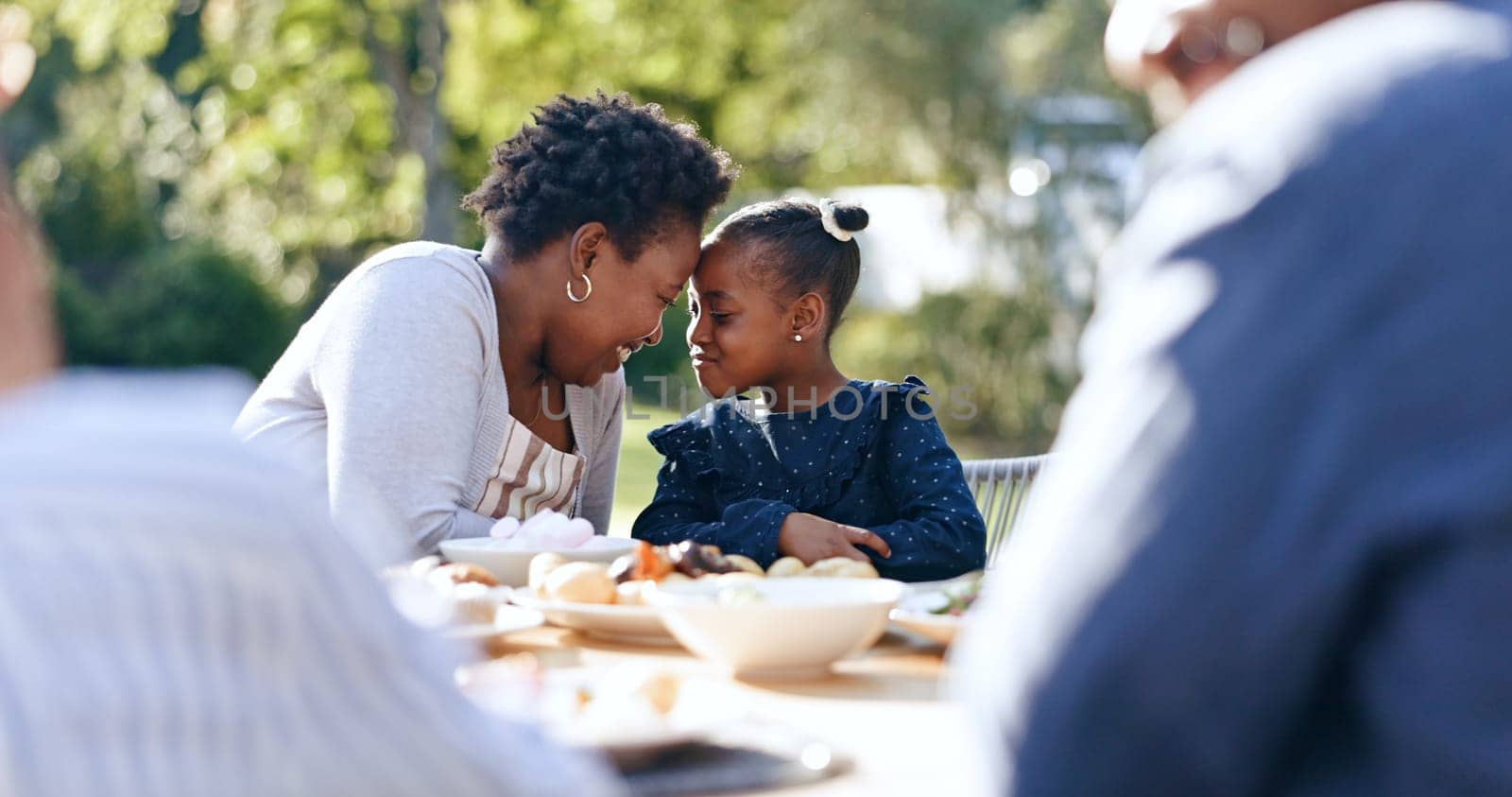 Smile, mother and daughter with forehead touch at garden lunch, nature and vacation together with love. Black people, woman or child with happy family, reunion and care for thanksgiving in park by YuriArcurs