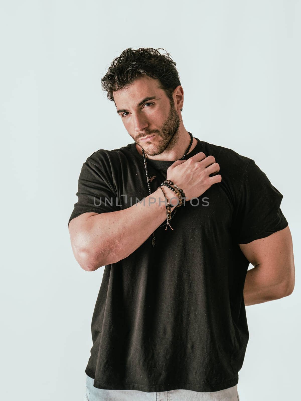 A Stylish Man in a Black Shirt Striking a Pose for a Captivating Photograph by artofphoto