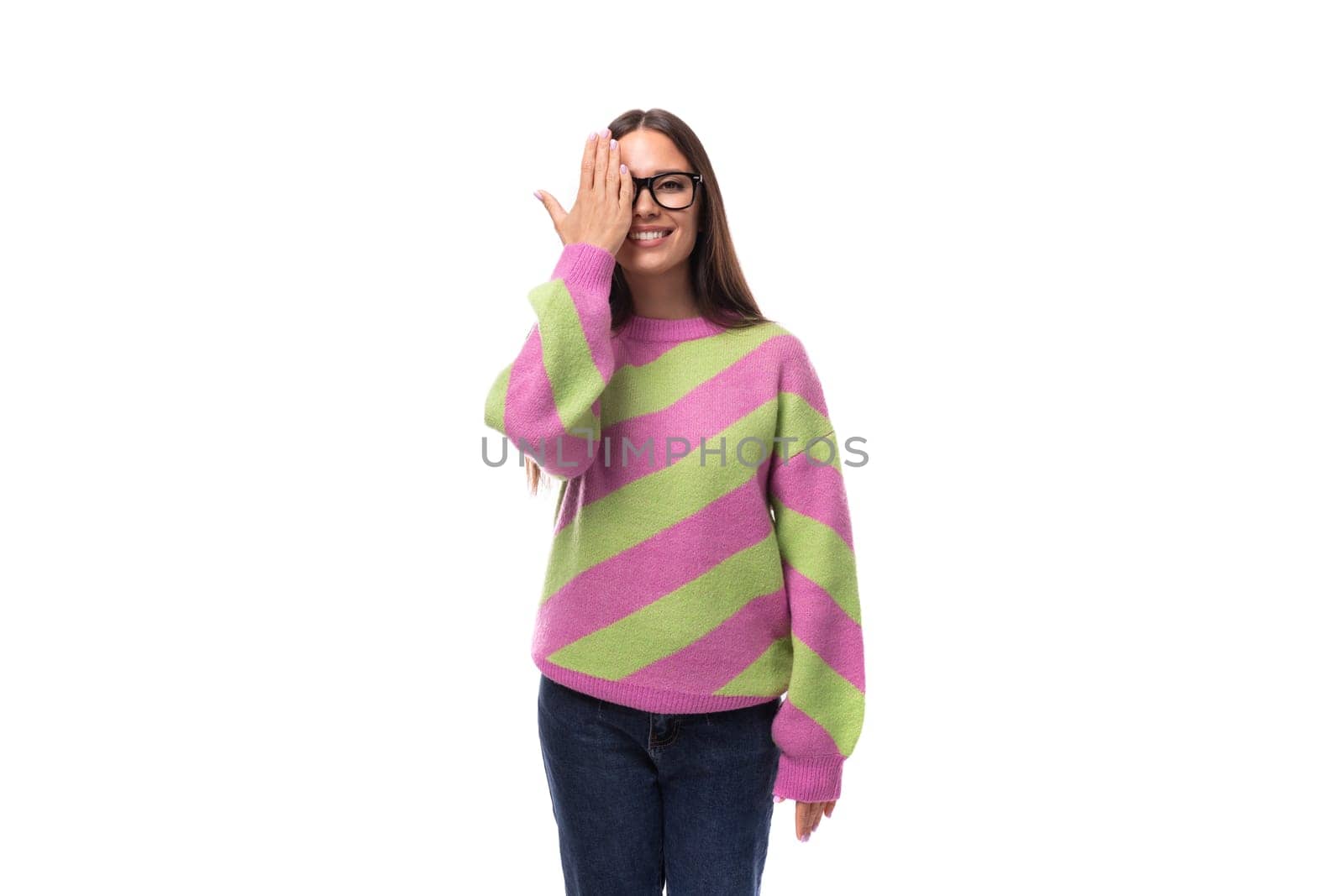 pretty beautiful young european brunette woman with vision glasses dressed in casual striped pink green pullover by TRMK