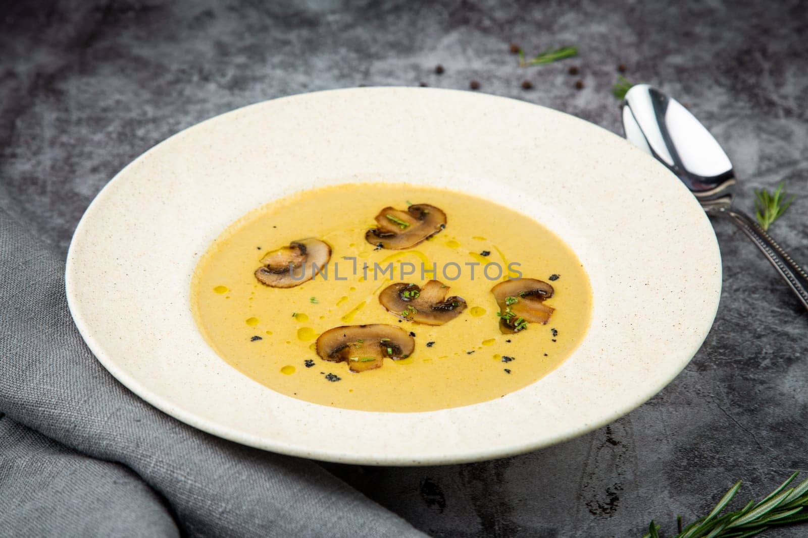 mushroom cream soup from champignons in a white plate