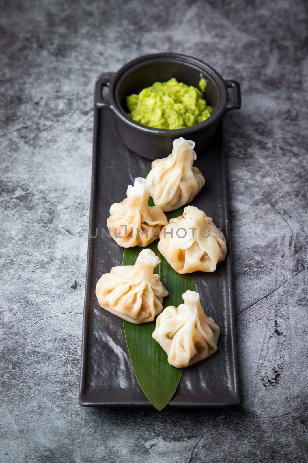 khinkali is a steamed Georgian dish of dough and ground beef side view by tewolf