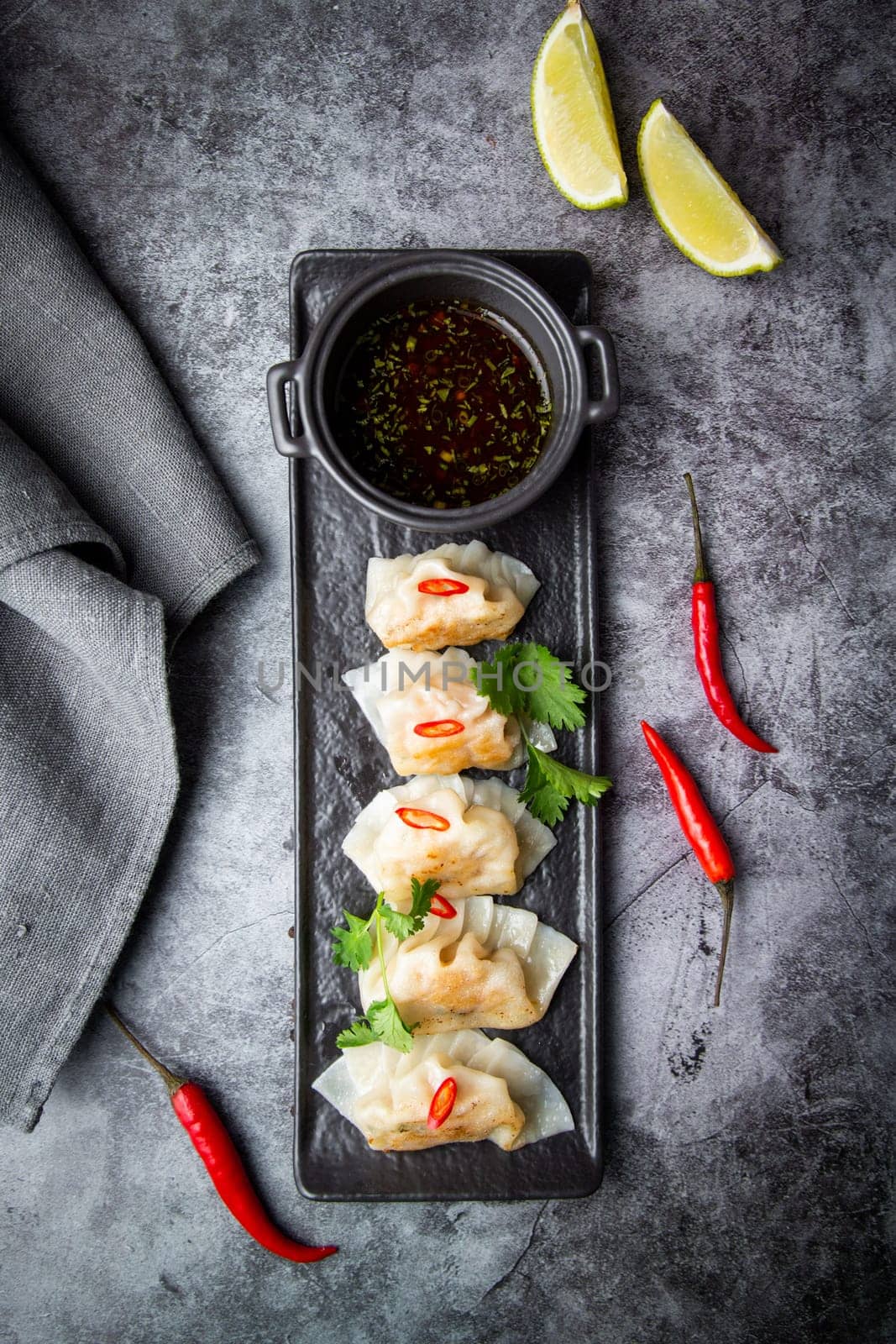 gyoza with shrimps with spicy soy sauce side view by tewolf