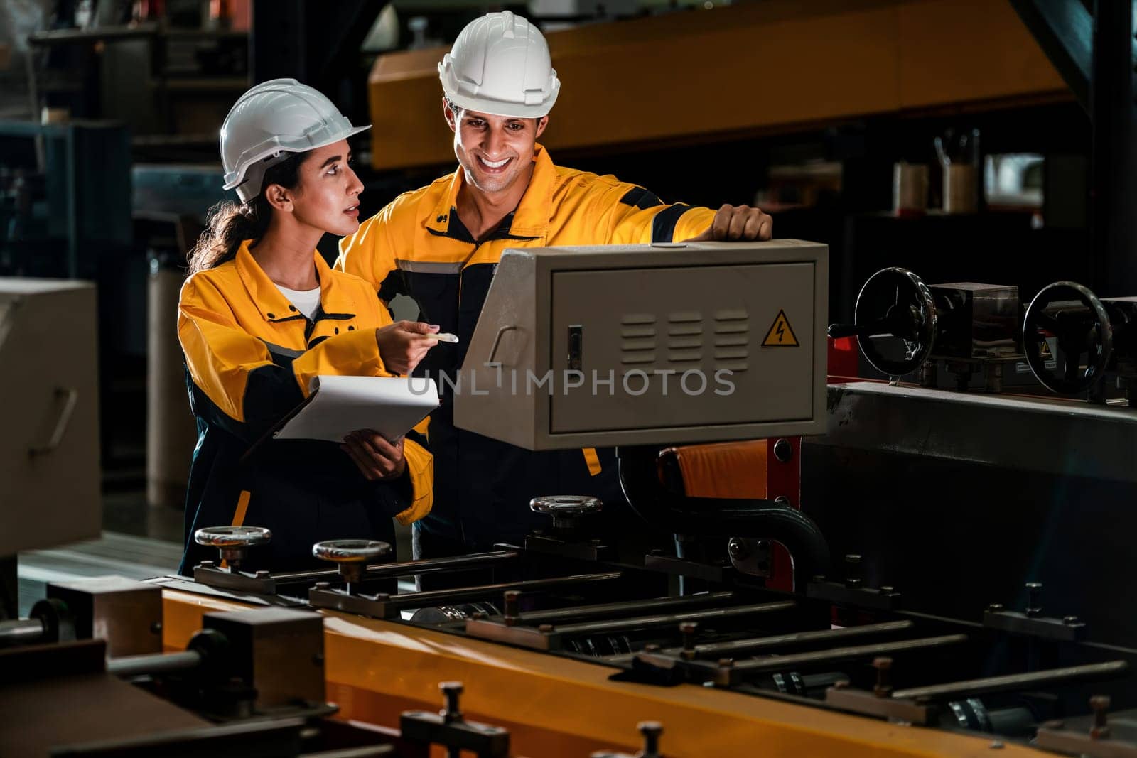 Professional quality control inspector conduct safety inspection on steel machinery and manufacturing process. Factory engineer or operator make optimization in heavy industry facility. Exemplifying