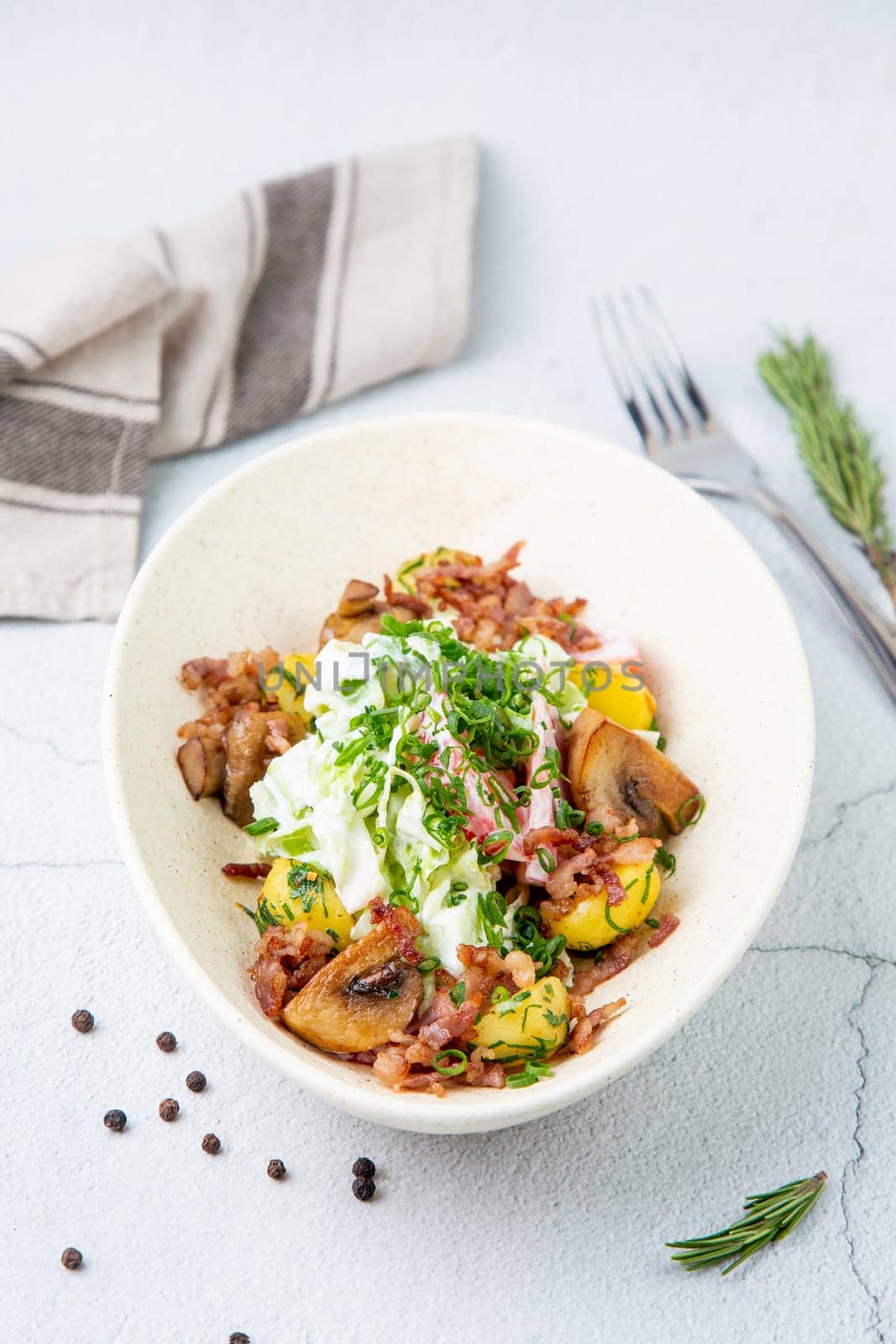 salad with potatoes, rice, meat and green onions top view by tewolf