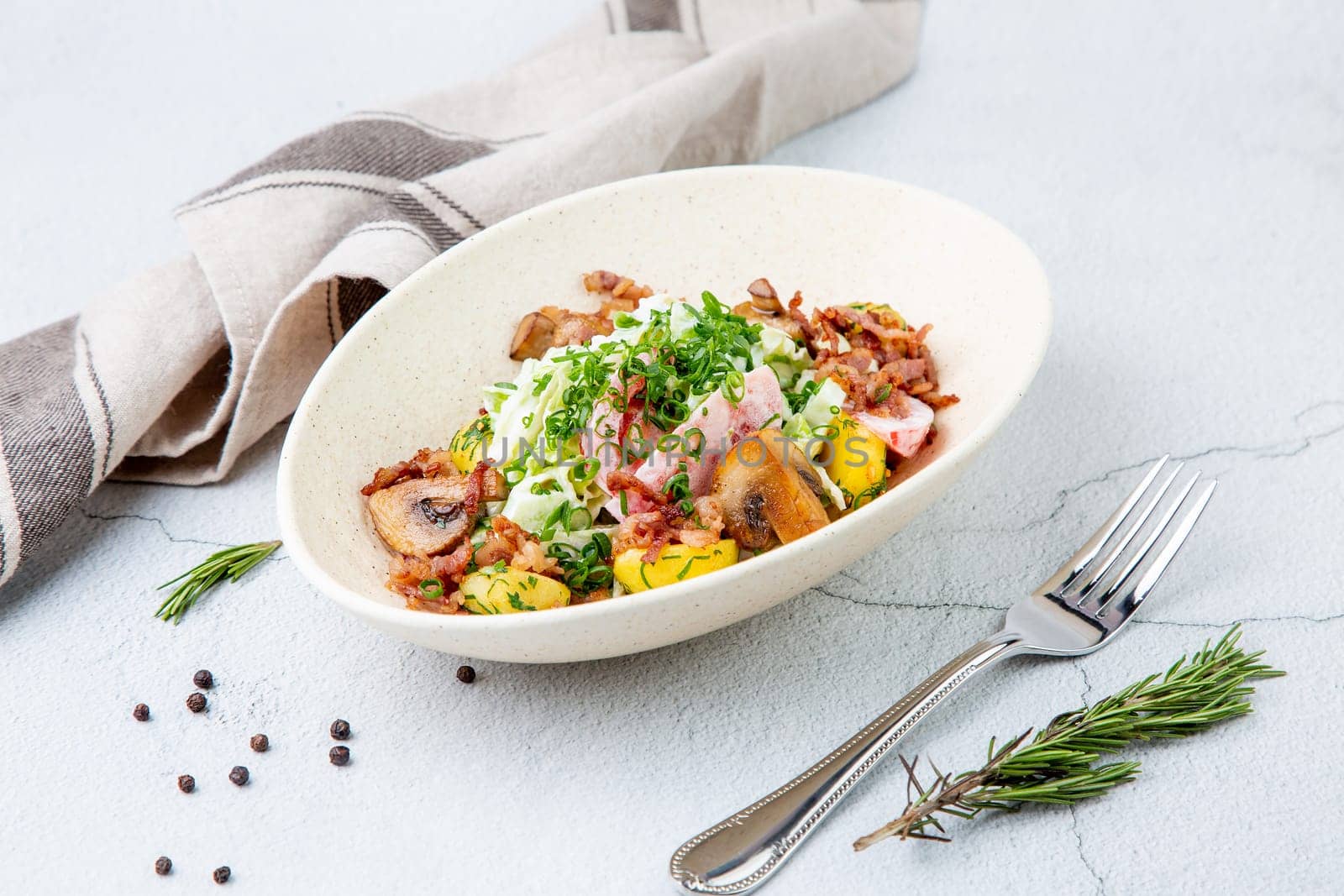 salad with potatoes, rice, meat and green onions