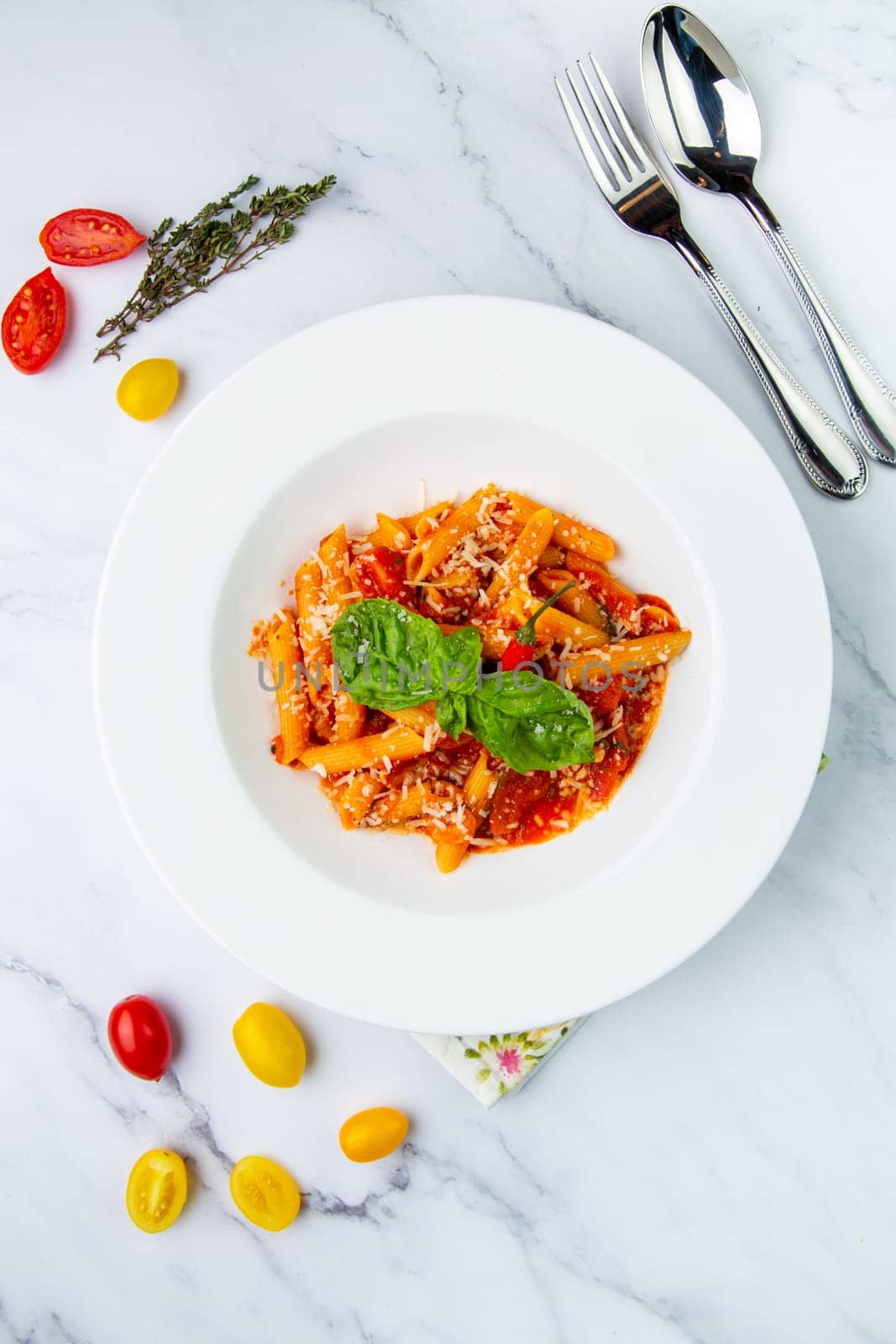 pasta in tomato sauce with cheese and herbs