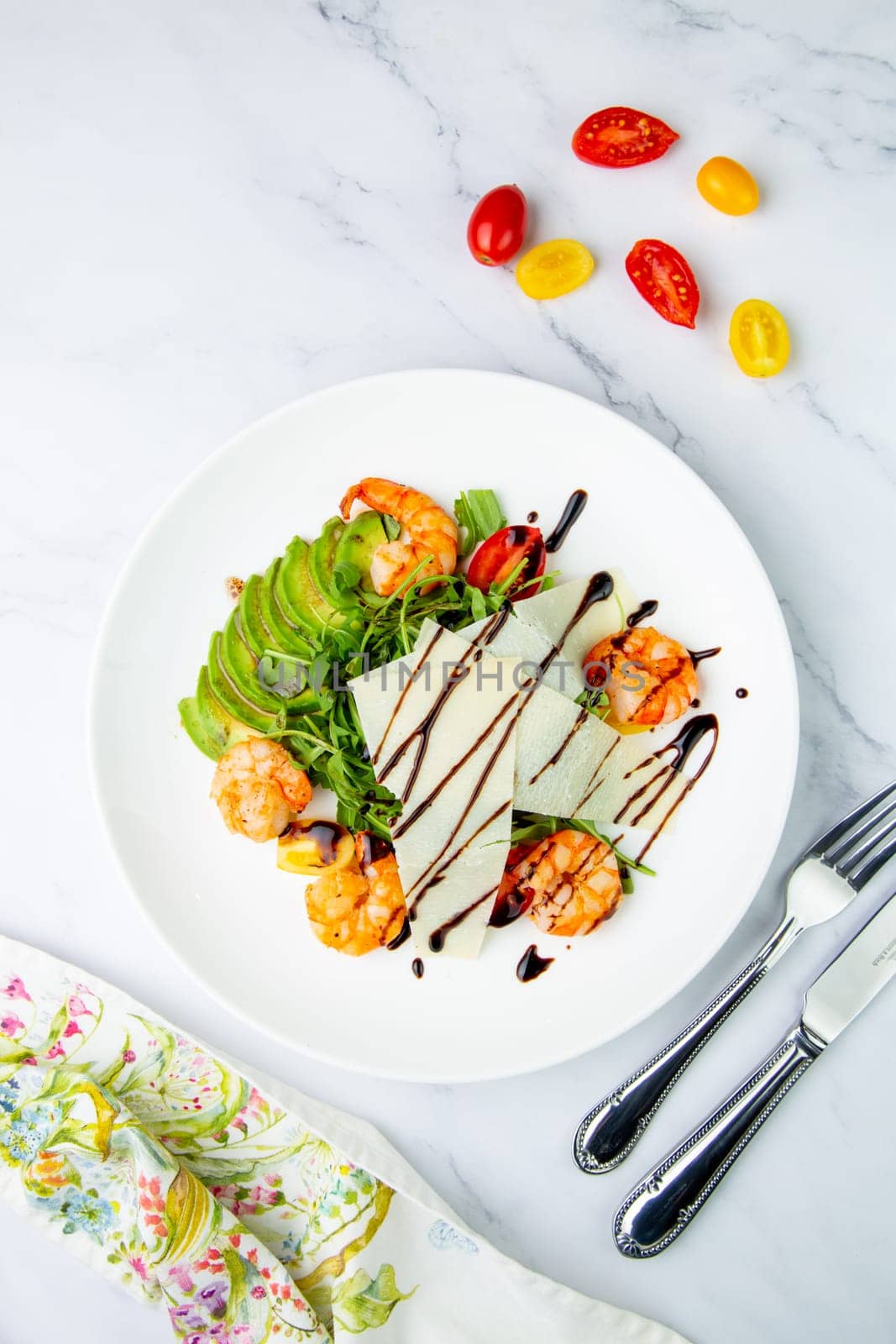 shrimp with avocado slices and arugula with teriyaki sauce