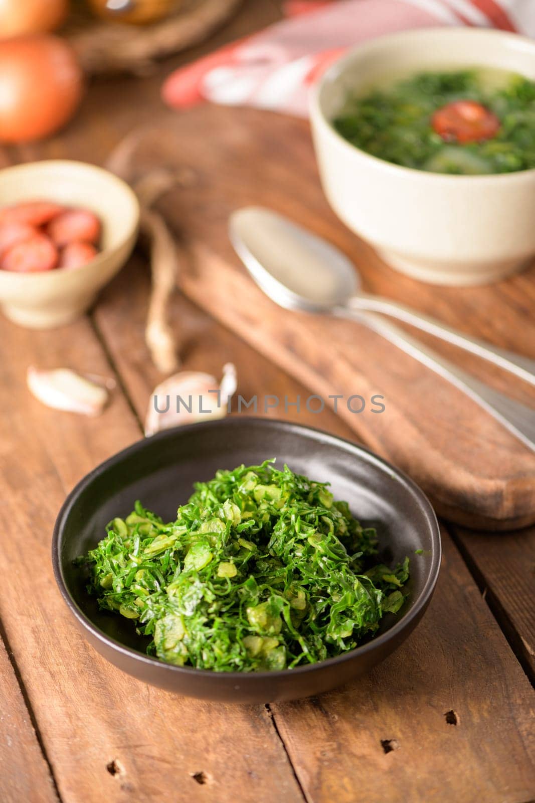 Caldo verde popular soup in Portuguese cuisine. traditional ingredients for caldo verde are potatoes, collard greens , olive oil and salt. Additionally garlic or onion may be added.