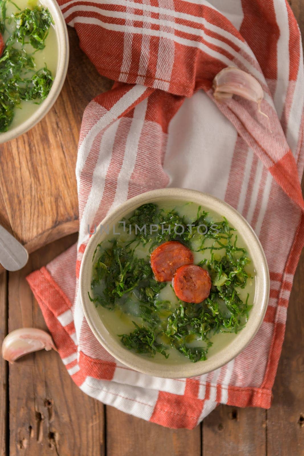 Caldo verde popular soup in Portuguese cuisine. traditional ingredients for caldo verde are potatoes, collard greens , olive oil and salt. Additionally garlic or onion may be added.