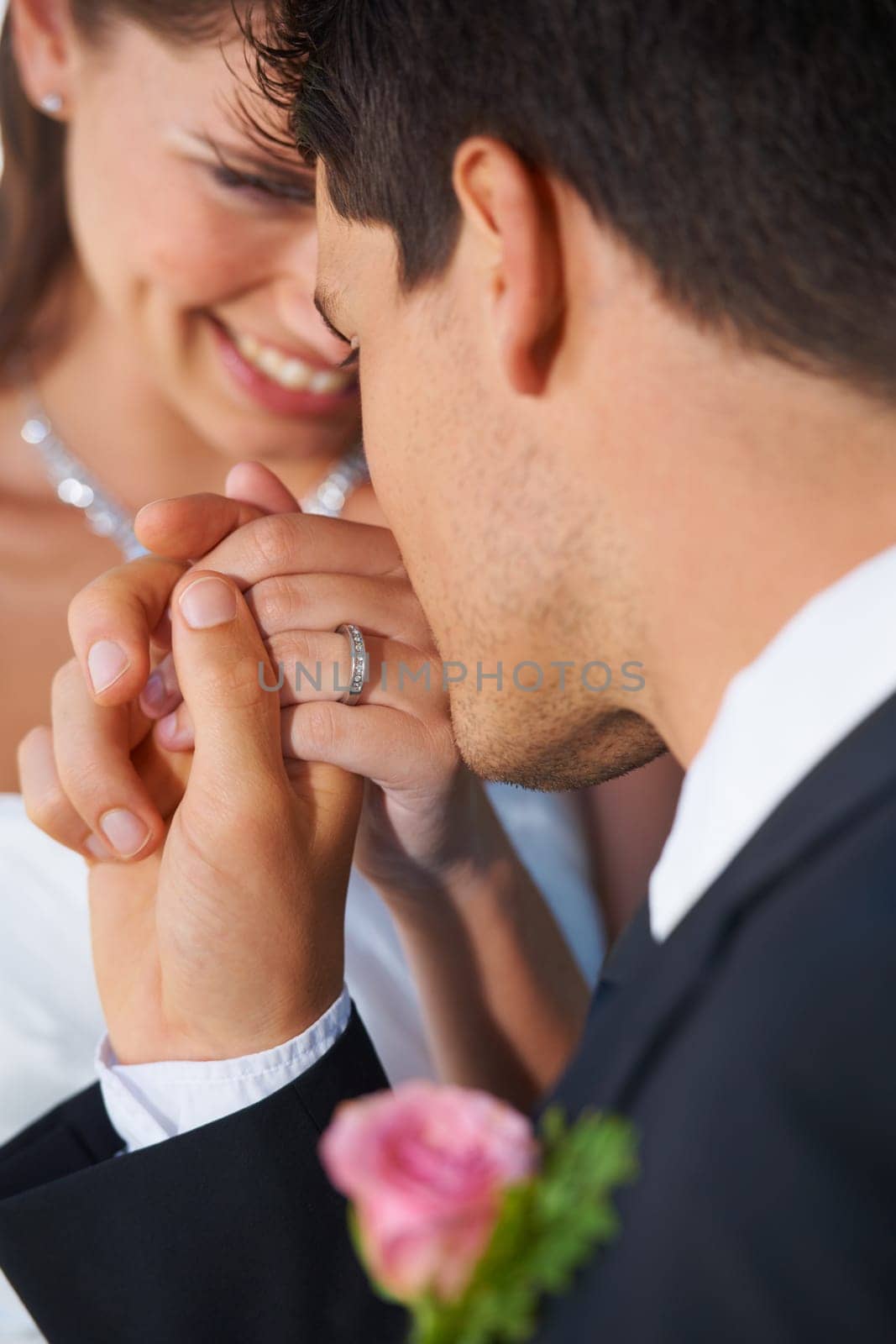 Couple, wedding ring and hand in marriage with bride and smile at celebration and trust event. Flower, loyalty and care with romance and holding hands with love and commitment with woman and man.