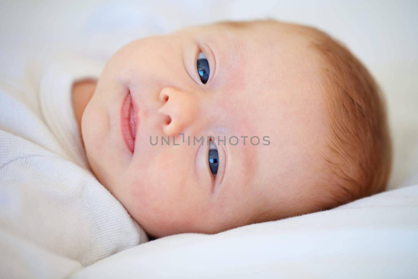 Closeup, portrait and baby for wake up in bedroom for sleep, relax or peaceful in morning. Infant, happy or good dream from nap with calm, care or hope for child growth, cognitive and development.