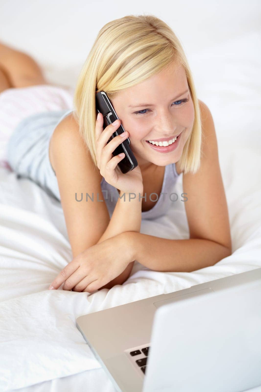Relax, laptop and phone call with woman on bedroom for contact, communication and connection. Happy, digital and technology with female person in home for calm, listening and mobile conversation.
