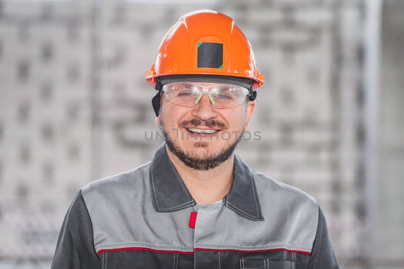 Construction worker portrait, caucasian man in hard hat, protective glasses and uniform, building and inspection by Rom4ek