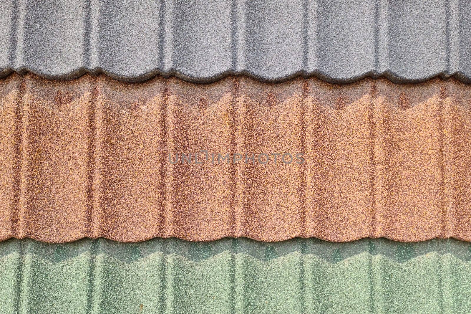 Background of roofing in the form of tiles sprayed in different colors.