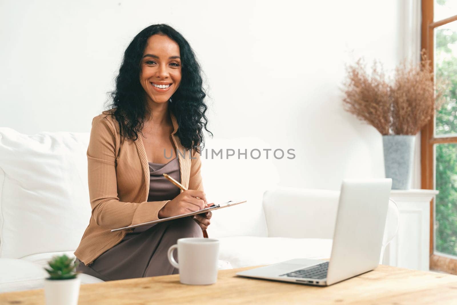 Psychologist woman in clinic office professional portrait with friendly smile feeling inviting for patient to visit the psychologist. The experienced and confident psychologist is crucial specialist