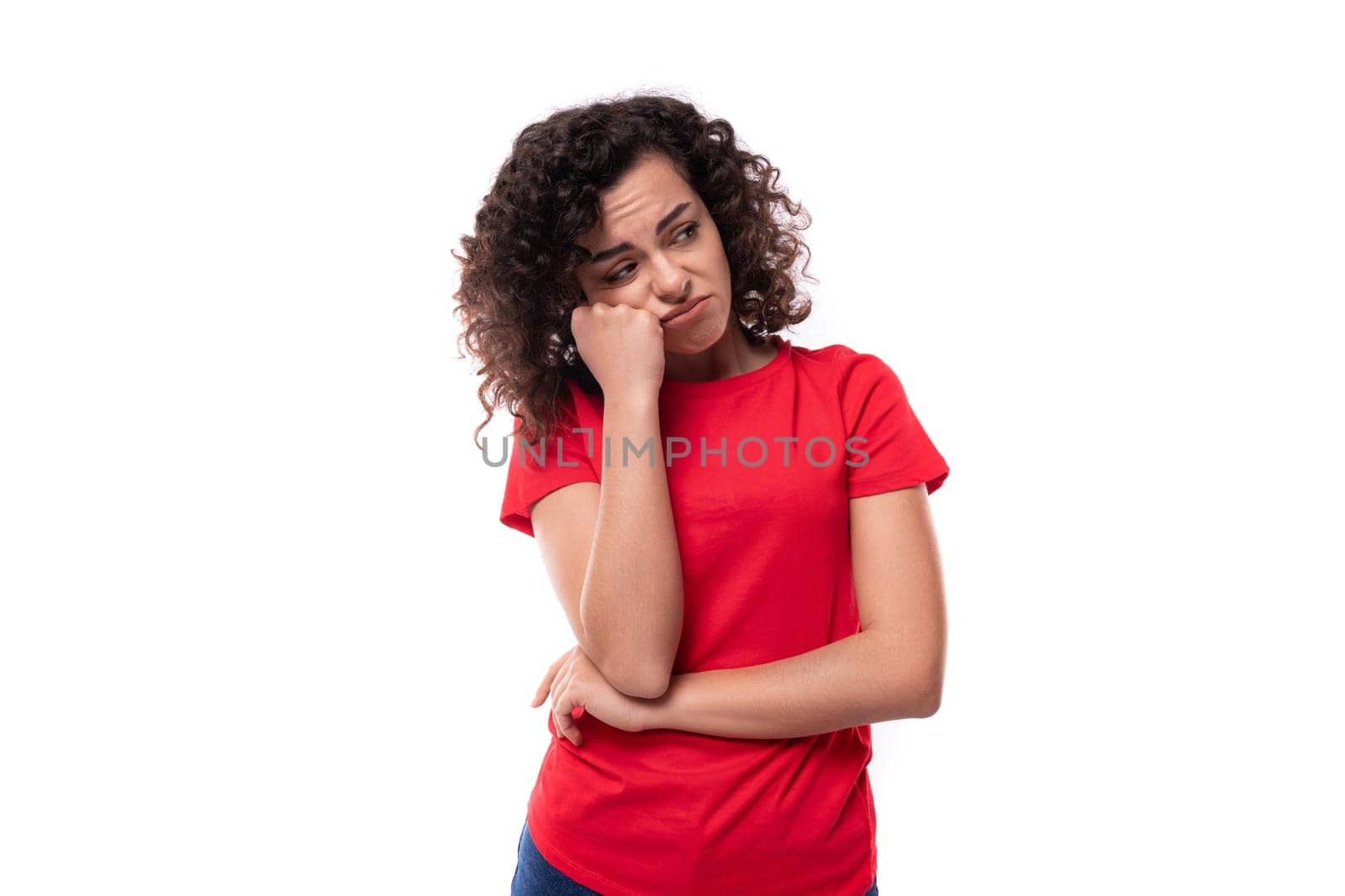 caucasian young sad curly brunette woman dressed in red casual t-shirt by TRMK